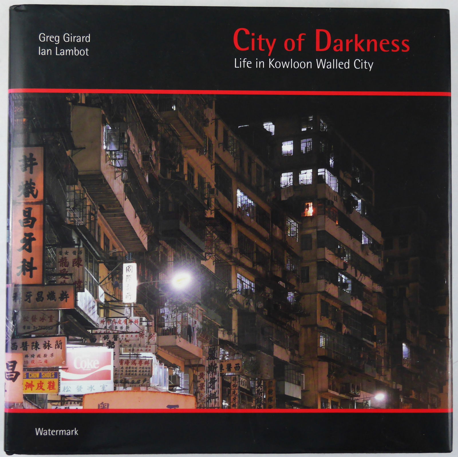 Girard, Greg, Lambert, Ian; City of Darkness: Life in Kowloon Walled City [1993 1ST ED 1ST PRINT: Watermark, 1993. Hardcover in pictorial dust jacket. First Edition, First Printing. 216 pages profusely illustrated in b/w and colour, including a double-page map. BOOK CONDITION: Fine; a solid, tight