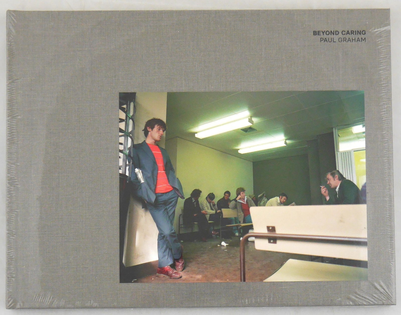 Graham, Paul; Beyond Caring [SIGNED 2021 3RD EDITION - FINE COPY]: Mack Books, London. 2021. Hardcover with color photographic image to front cover. Third edition. Numerous photographic images in color throughout. Text in English. SIGNED by Paul Graham below an extra