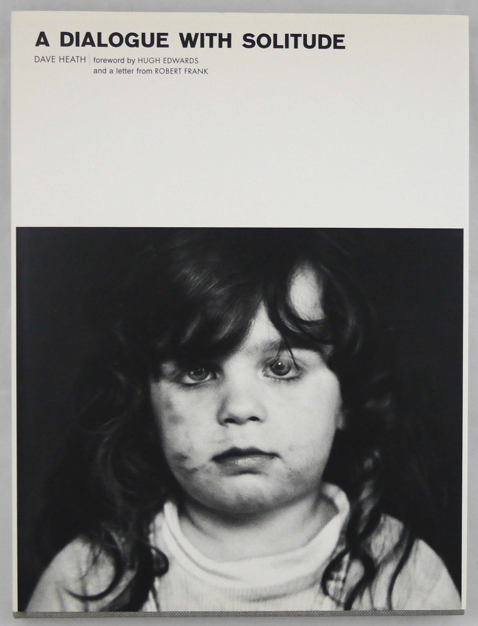 Heath, Dave; A Dialogue with Solitude [SIGNED - 2000 LUMIERE REPRINT IN FINE CONDITON]: Lumiere Press, Toronto, Canada. 2000. Hardcover in pitorial dust jacket. 2nd Edition. Unpaginated with 83 duotone illustrations. SIGNED by Dave Heath on the title page. BOOK CONDITION: Fine; a tight,