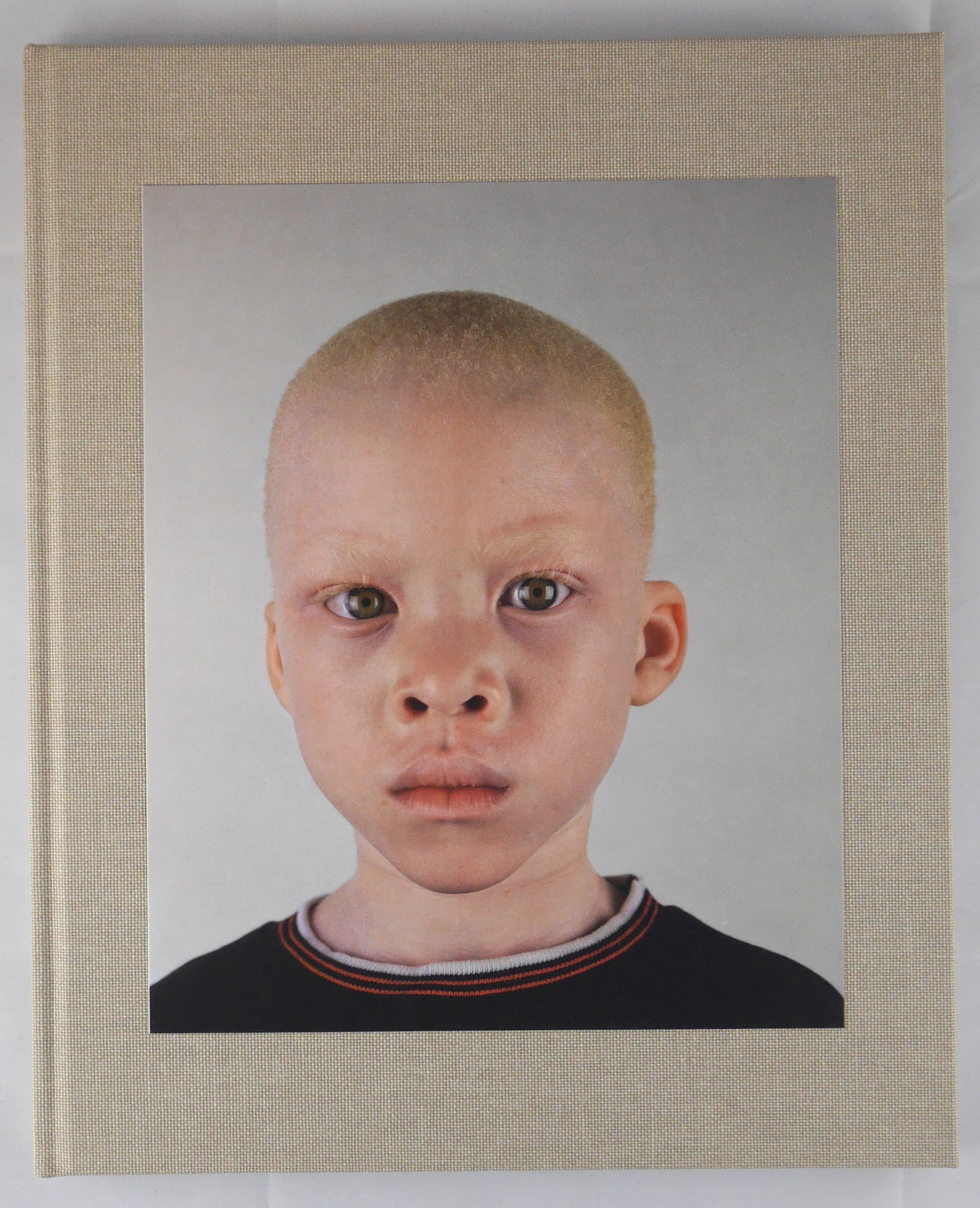 Hugo, Pieter; Looking Aside [2006 1ST EDITION & 1ST PRINTING - FINE COPY]: Cape Town, South Africa: Punctum Editions 2006. Hardcover with tipped in image to front cover. First edition, first printing. 12" x 9 3/4" . 92 pages with 54 color photographic images throughout. Phot