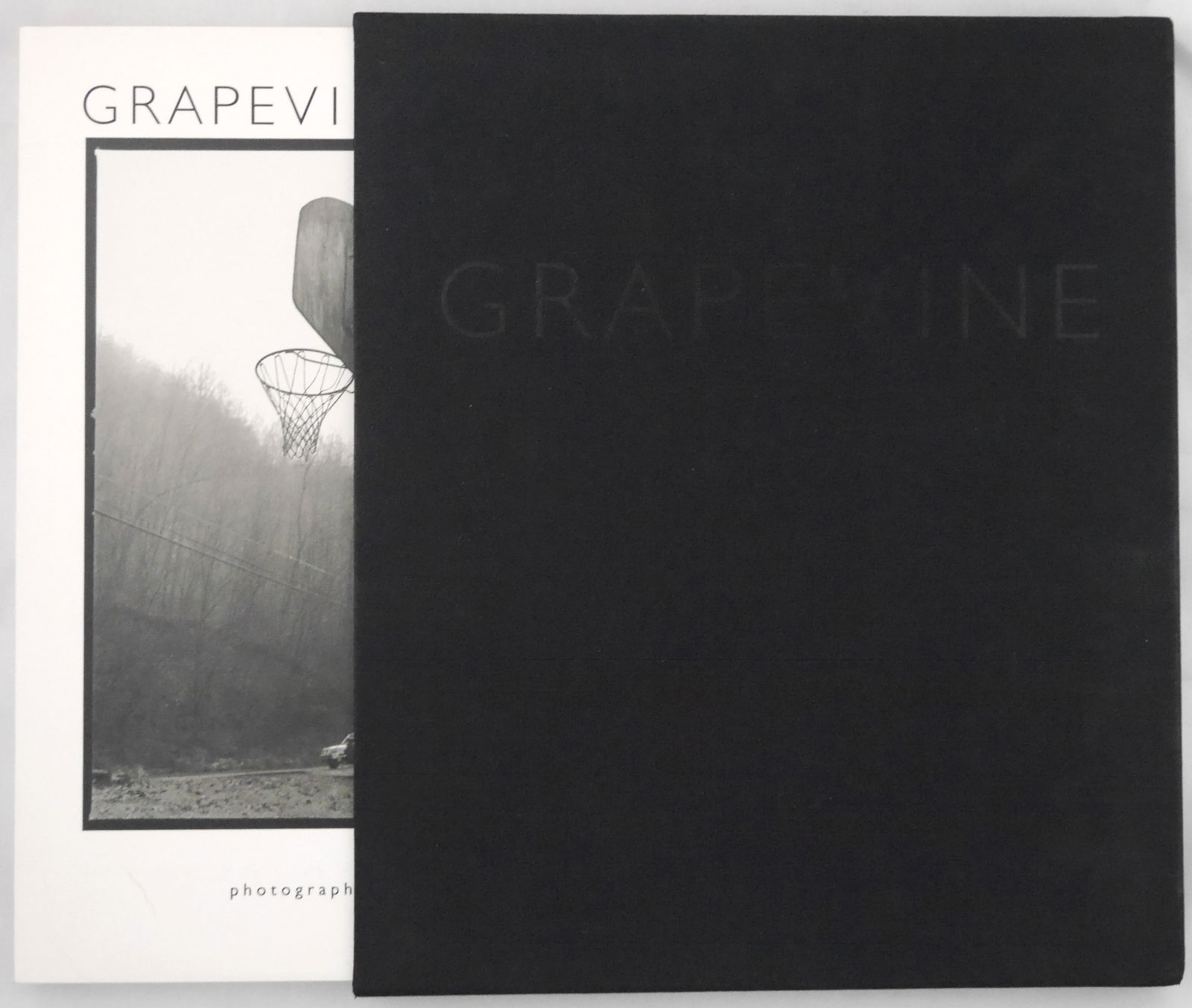 Lipper, Susan; Grapevine [SIGNED DELUXE LTD ED #/35 IN SLIPCASE WITH GELATIN SILVER PRINT]: SIGNED DELUXE EDITION WITH PRINT Grapevine. Photographs with brief intro and conversations with subjects by Susan Lipper. Cornerhouse Publications, Manchester, 1994. 111 pp. Quarto (11 x 13 in./28 x 3