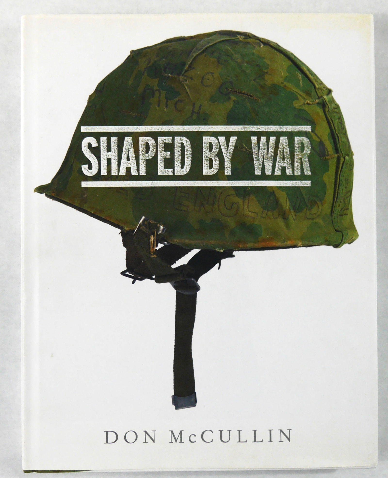 Don McCullin, Shaped by War [SIGNED 2010 1ST ED 1ST PRINT - FINE]: SIGNED COPY - Jonathan Cape, 2008. Hardcover in pictorial dust jacket. First Edition, First Printing. 12 x 9 inches. 208 pages with with McCullin's photographic work as a war photographer. Illustrated