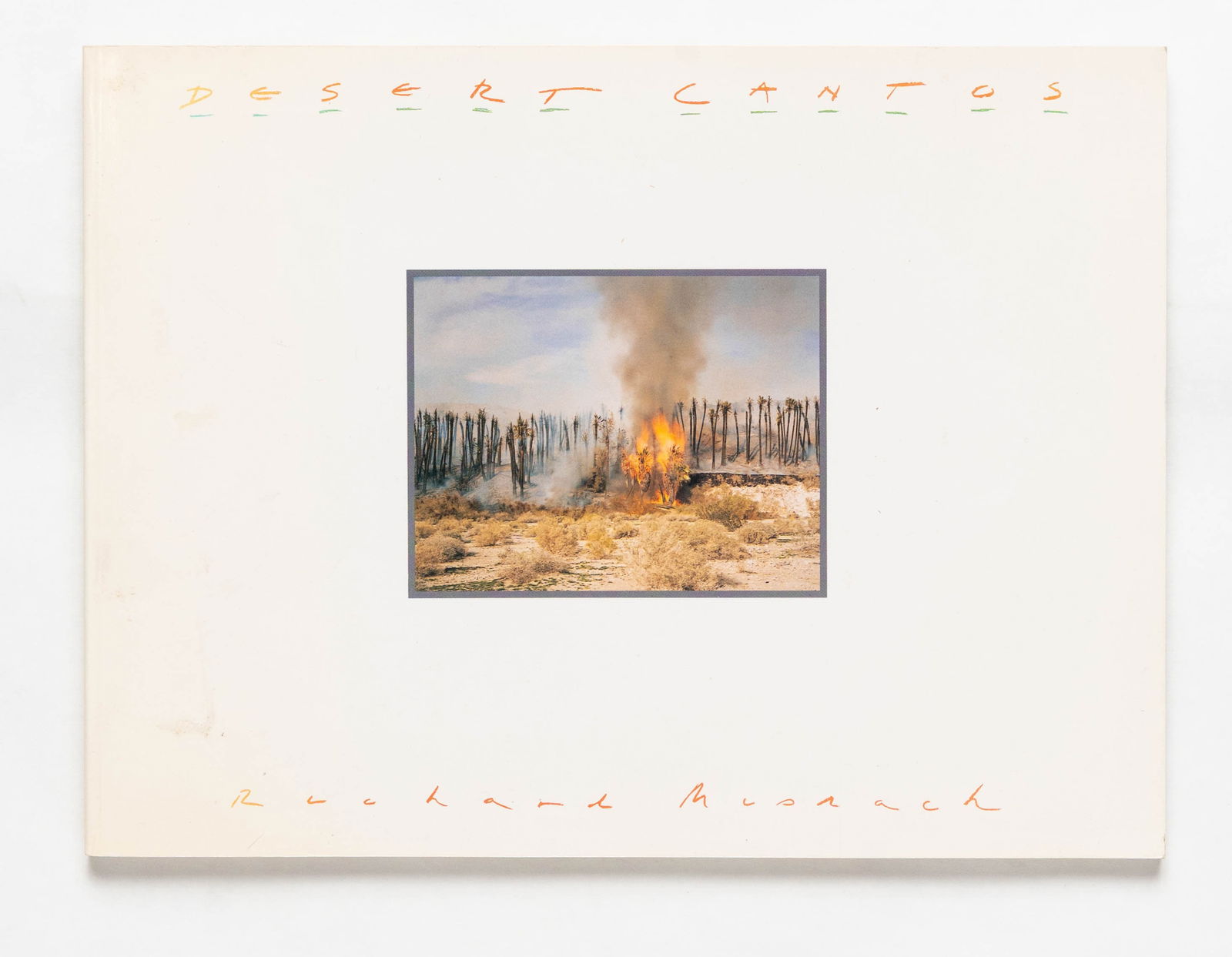 Misrach, Richard; Desert Cantos [SIGNED 1987 1ST EDITION]: University of New Mexico Press, Albuquerque NM, 1987. Softcover in pictorial wraps. First Edition (stated). 12 x 9 inches. 108 pages with numerous color photographic images throughout detailing, with