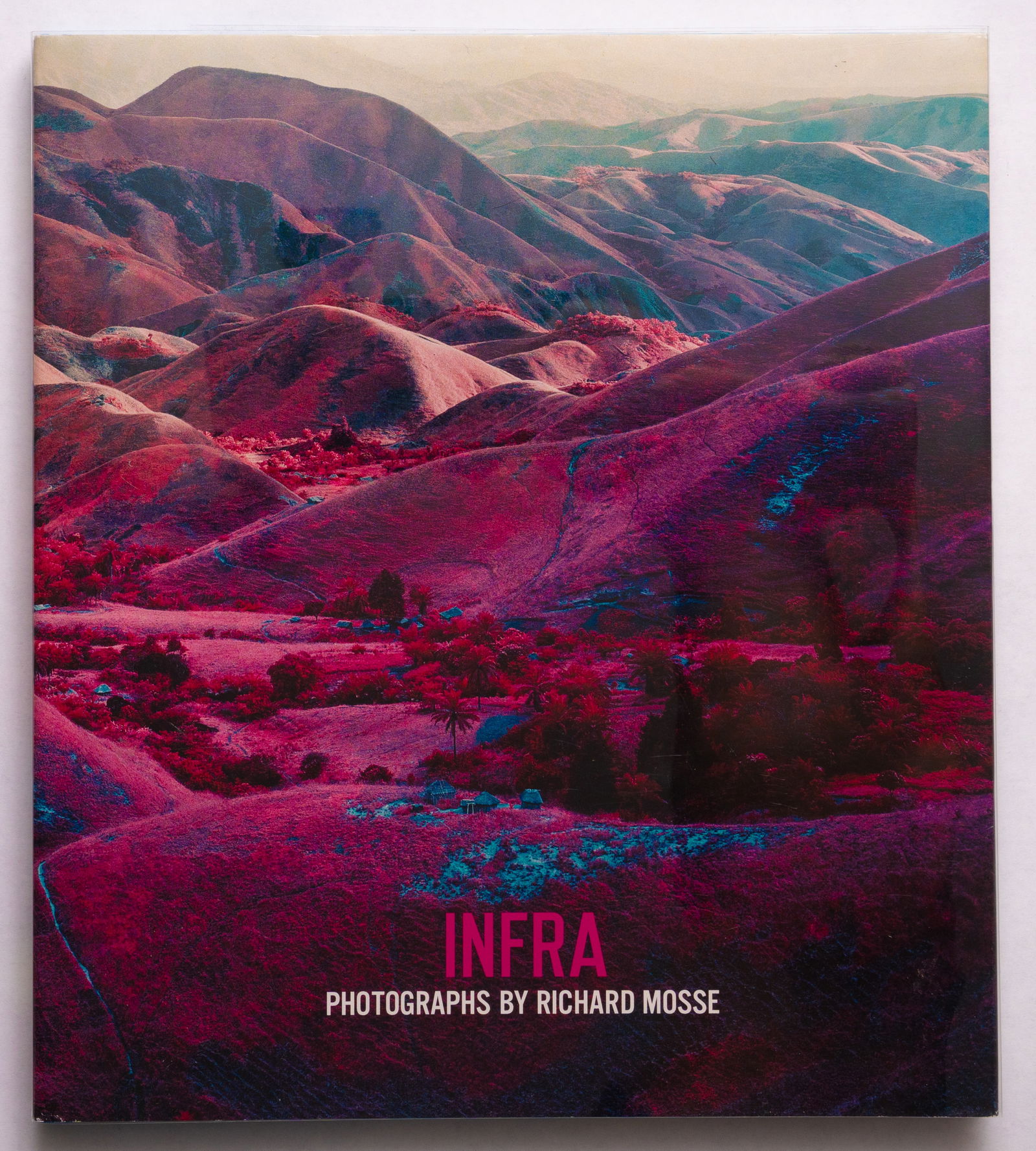 Mosse, Richard; Infra [2012 1STEDITION & 1ST PRINTING - FINE COPY]: Aperture, 2012. Hardcover in pictorial dust jacket. First Edition, First Printing. 136 pages with numrous color photographic images throughout. BOOK CONDITION: Fine; a tight, clean copy in a Fine dust
