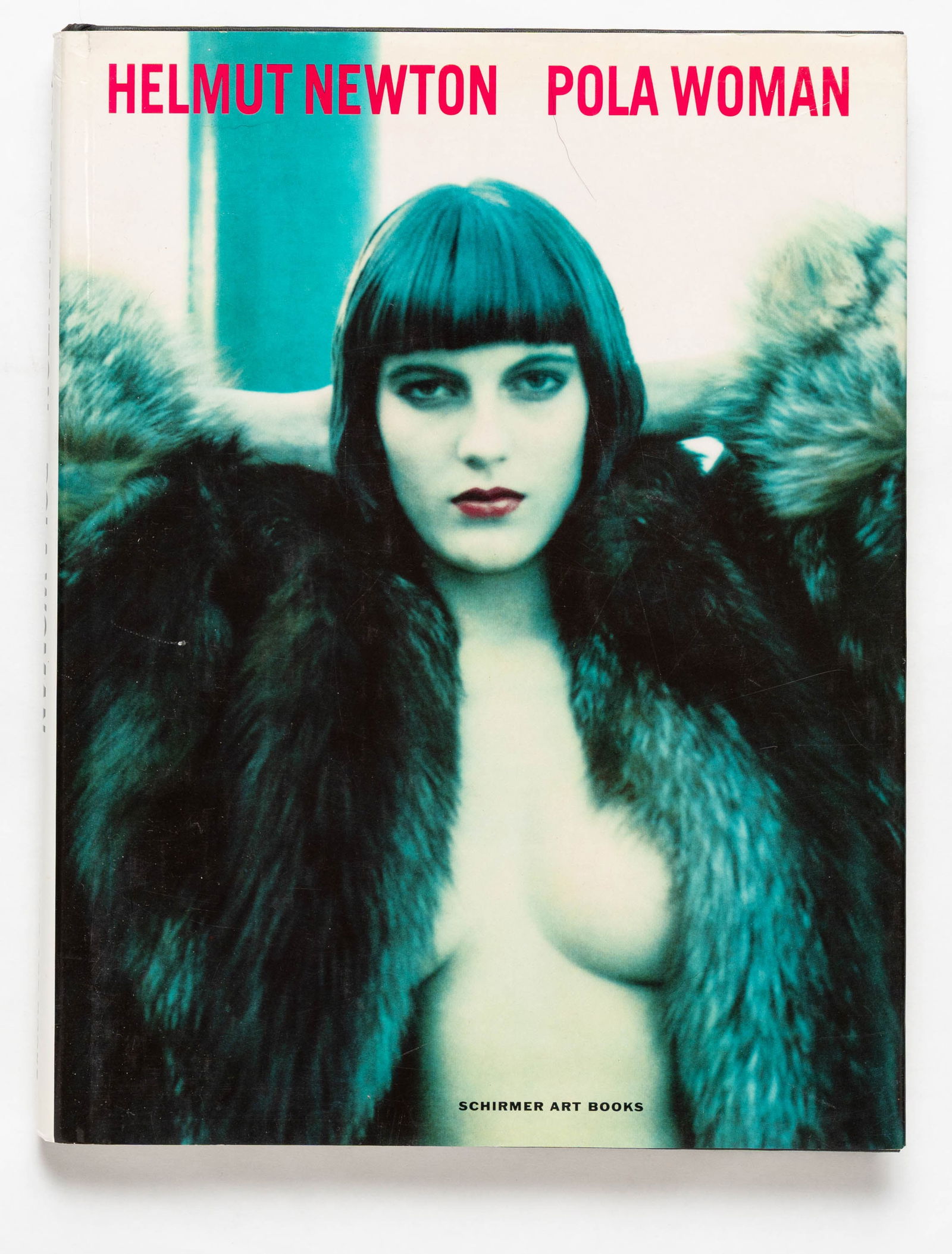 Helmut Newton, Pola Woman [1992 1ST EDITION - FINE]: Schirmer Art Books, Munich, 1992. Hardcover in pictorial dust jacket. First Edition, First Printing. 4°. 152 pages with 175 polaroids by helmut Newton (74 in color and 101 in black and white). BOOK C