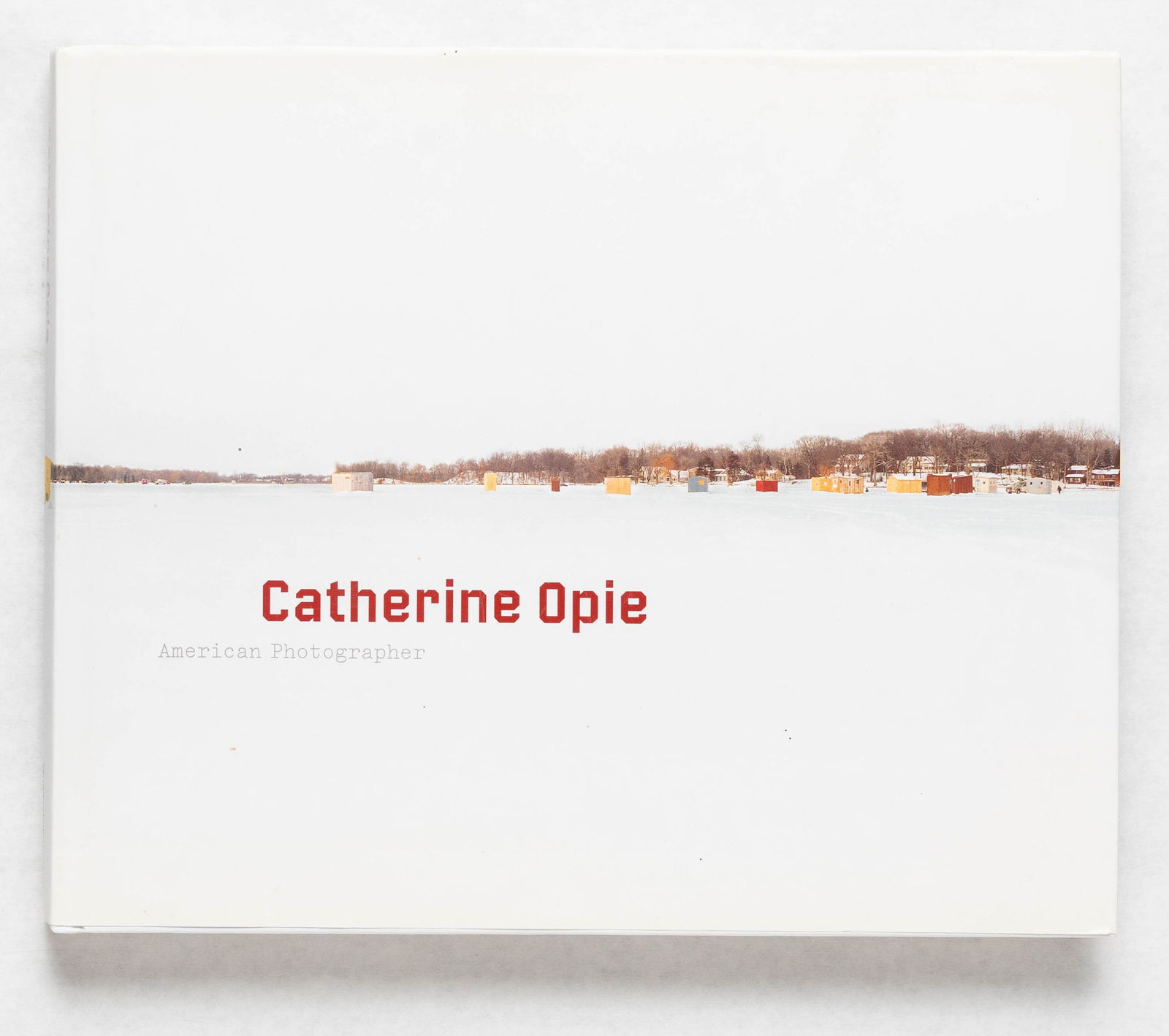 Catherine Opie, American Photographer [SIGNED 2008 1ST EDITION - FINE]: SIGNED COPY - Guggenheim Foundation, 2008. Hardcover in pictorial dust jacket. First Edition, First Printing. Oblong Quarto. 288 pages with nmumerous color and black and white photographic images thro