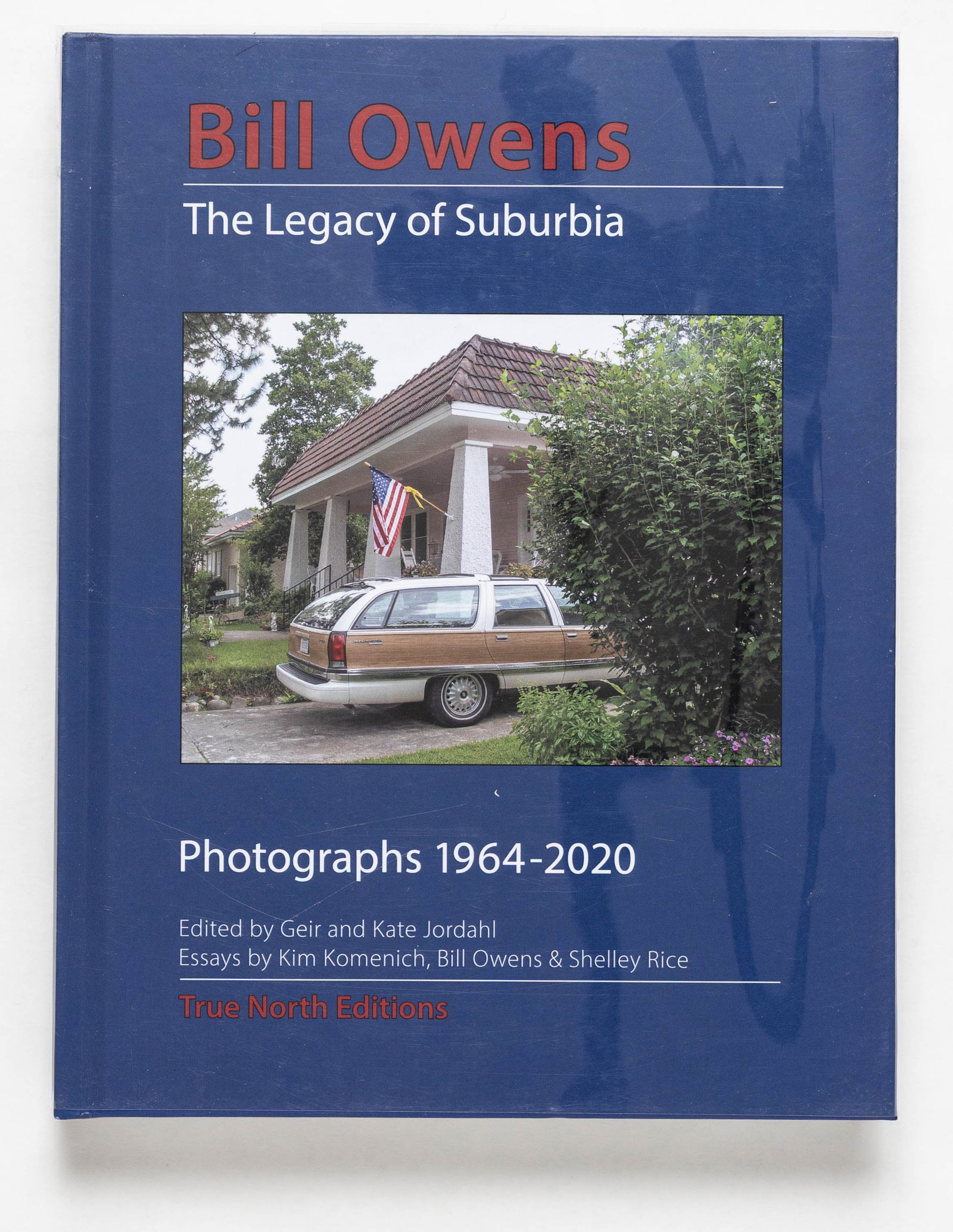 Owens, Bill; The Legacy of Suburbia: Photographs 1964-2020 [SIGNED LIMITED EDITION - FINE]: True North Editions, 2020. Hardcover in printed boards. First Edition, First Printing. Limited Edition of only 100 copies. 10 x 7 inches. 320 pages filled with photographic images in black and white a