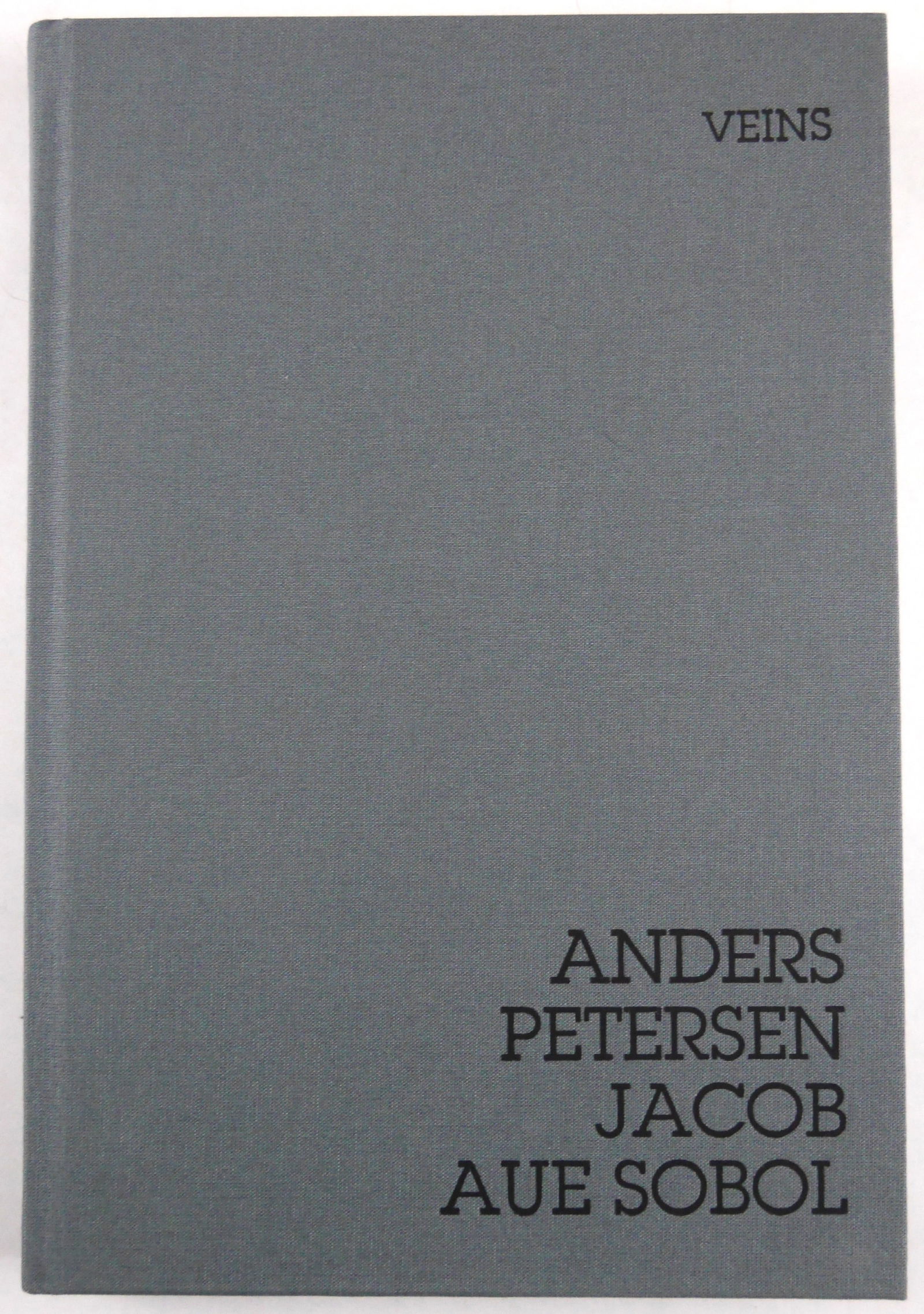 Petersen, Anders; Aue Sobol, Jacob; Veins [2013 1ST EDITION - FINE]: Dewi Lewis, 2013. hardcover in cloth boards. First Edition, First Printing. 144 pages with 90 tritone plates. First half features photos by Anders Petersen and the second half by Jacob Aue Sobol. Intr