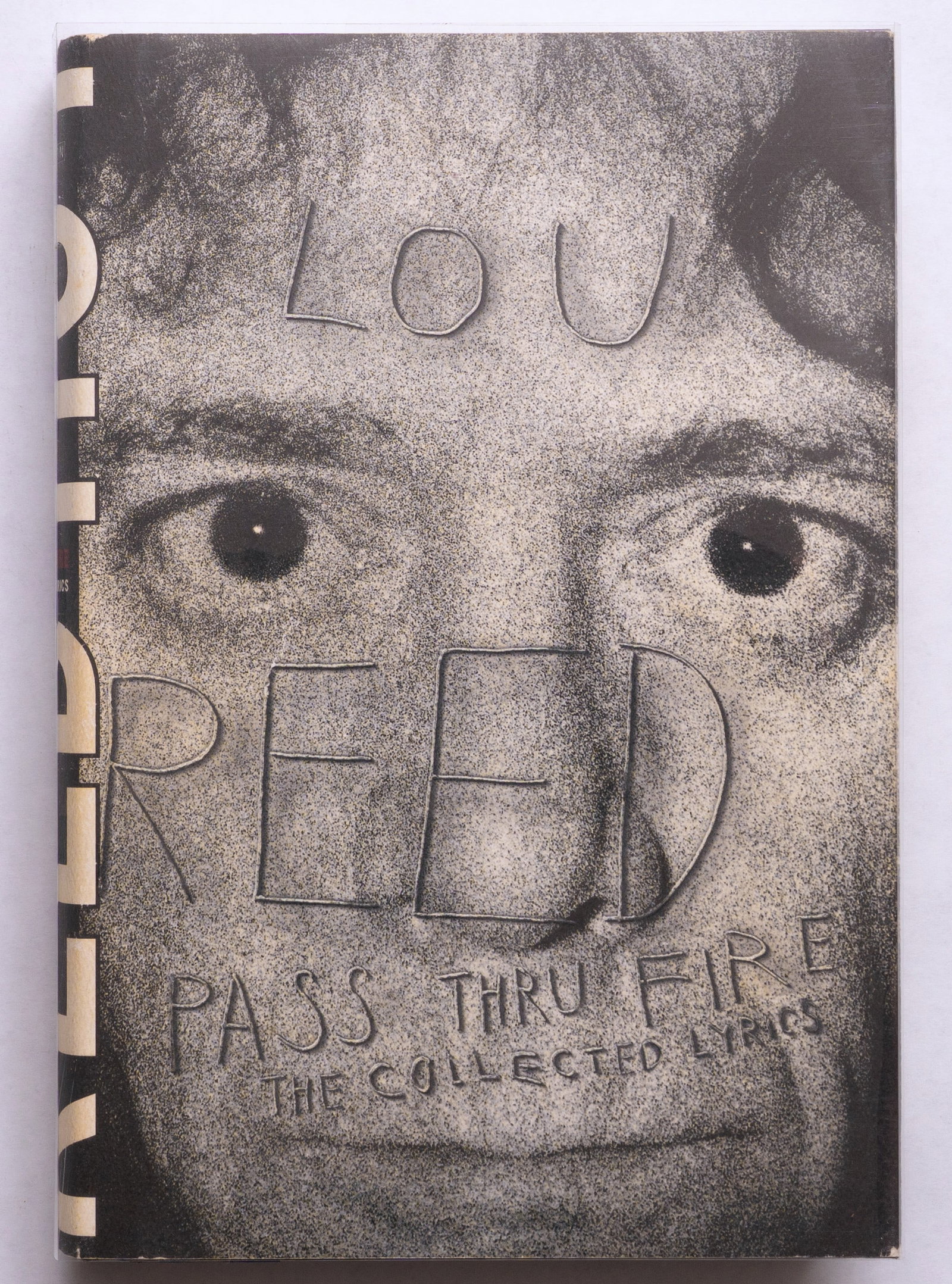 Lou Reed, Pass Thru Fire The Collected Lyrics [SIGNED 2000 1ST EDITION 1ST PRINTING - FINE]: SIGNED COPY Hyperion Books, 2000. Hardcover in pictorial dust jacket. First Edition, First Printing. 469 pages offering Lou Reed's complete lyrics. SIGNED/INSCRIBED "To Darrell / Lou Reed". BOOK CONDI