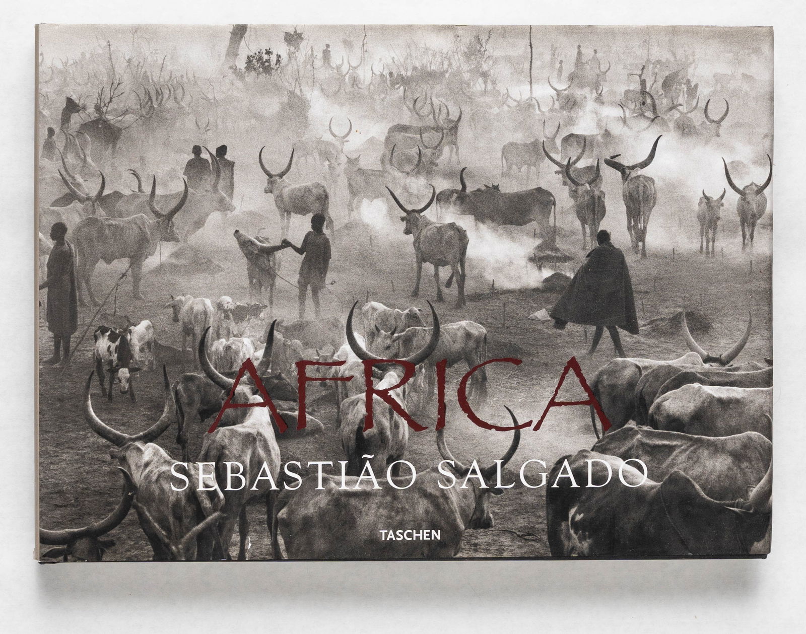 Salgado, Sebastiao; Africa [2007 1ST EDITION & 1ST PRINTING]: Taschen, 2007. Hardcover in pictorial dust jacket. First edition, First Printing. Oblong quarto. 335 pages with numerous black and white photographic images throughout offering a collection of Salgado
