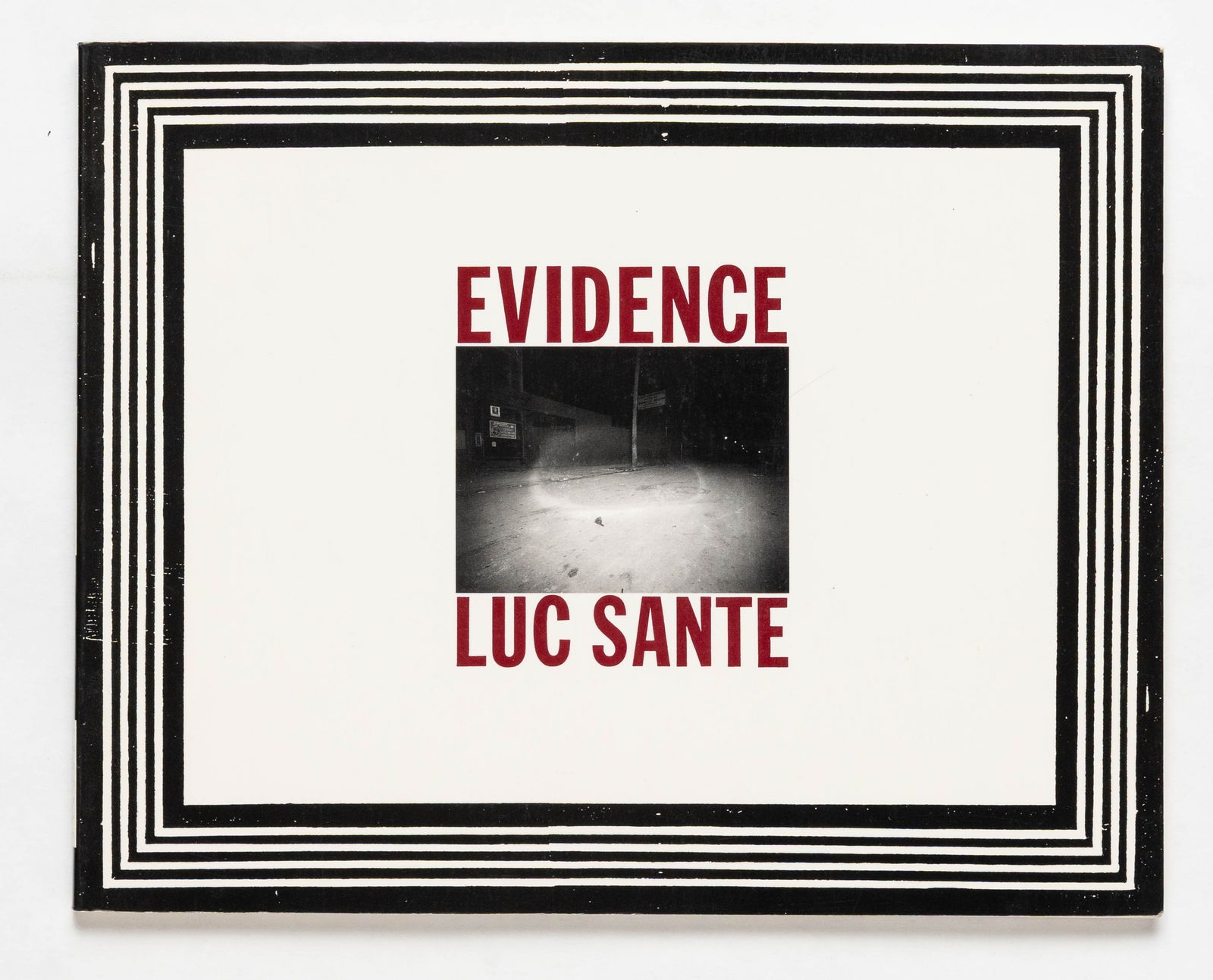 Sante, Luc; Evidence [SIGNED 1992 1ST EDITION]: Ferrar, Strauss and Giroux, 1992, Softcover in pictorial wrappers. First Edition. 7 x 5 inches. 55 black and white photographic images taken between 1914 and 1918 by the NYC Police department showing