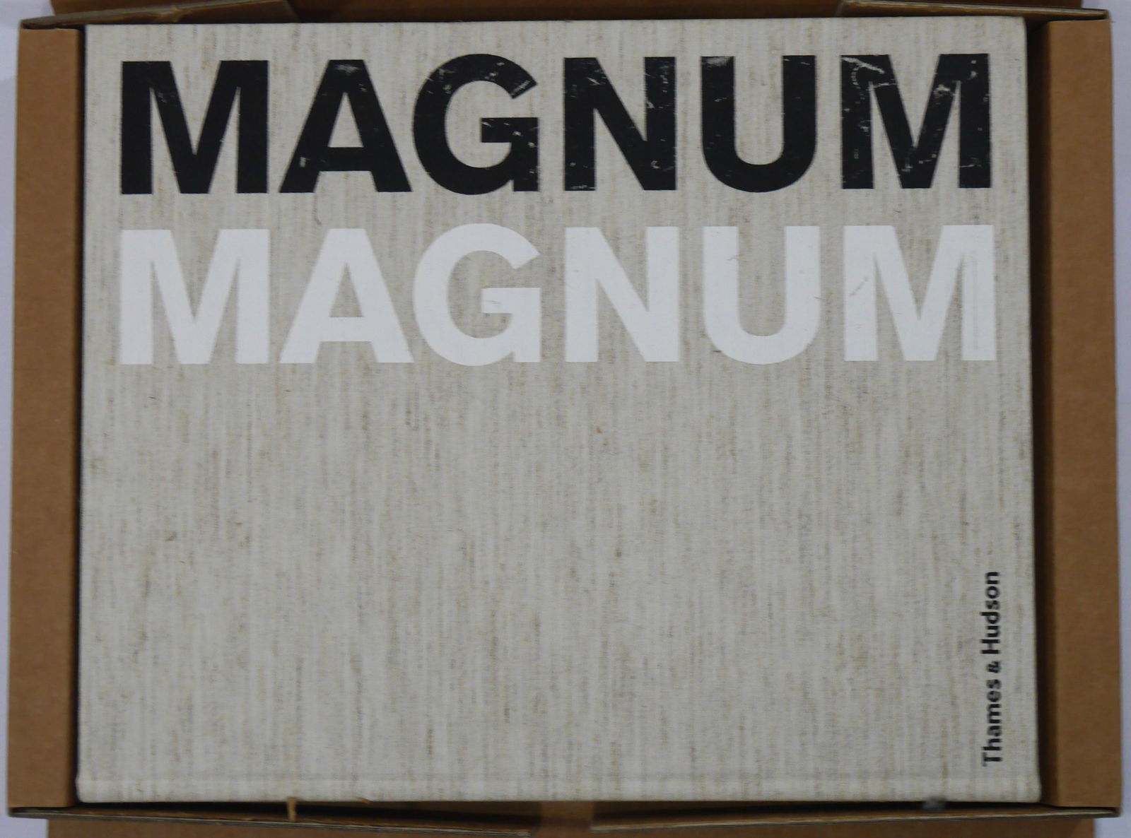 Magnum Magnum [2007 1ST EDITION IN ORIGINAL SHIPPING BOX] Soth, Alec; Parr, Martin; Meiselas, Susan;: London Thames and Hudson 2007. Hardcover in original printed carrying case/shipping box. Oversized 18" x 14". 568 pages with 413 photographs in colour and duotone. Includes sections on Arnold, Eve;
