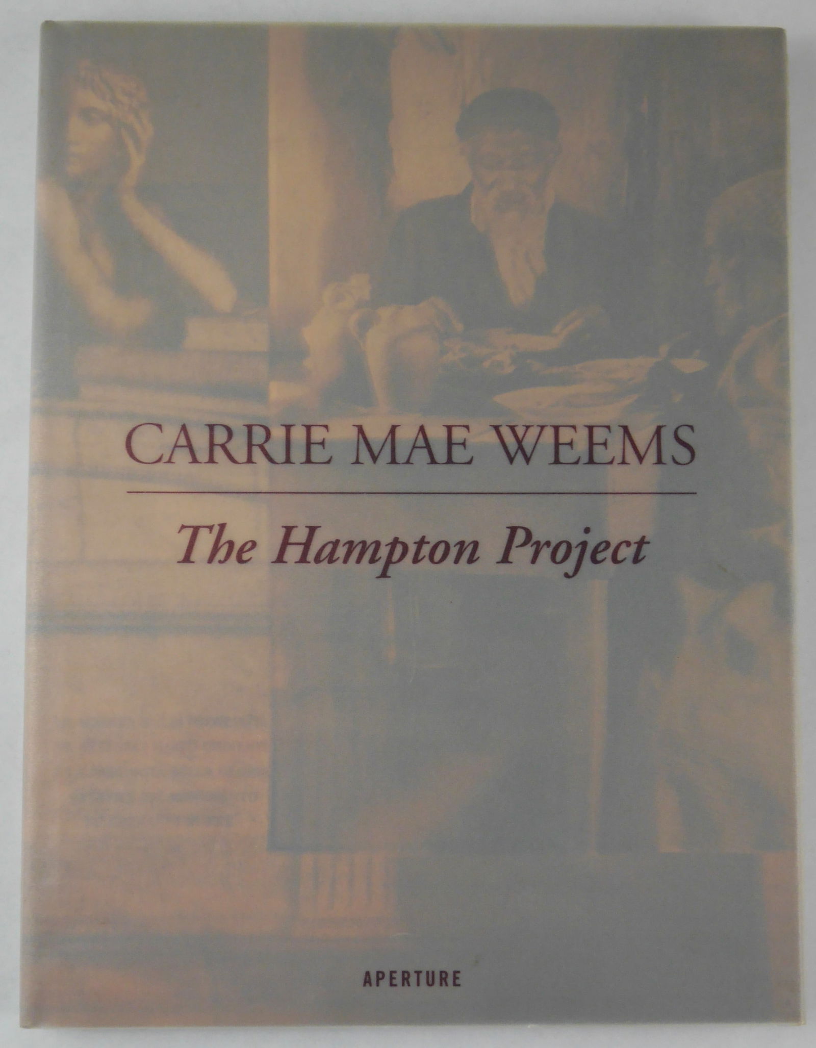 Carrie Mae Weems The Hampton Project [SIGNED - 2001 APERTURE 1ST EDITION 1ST PRINTING - FINE]: Aperture, 2001. Hardcover in tanslucent dust jacket. First Editon, First Printing (with the full numberline ending in 1). 12 x 9 inches. 96 pages with numerous photographic images throughout.