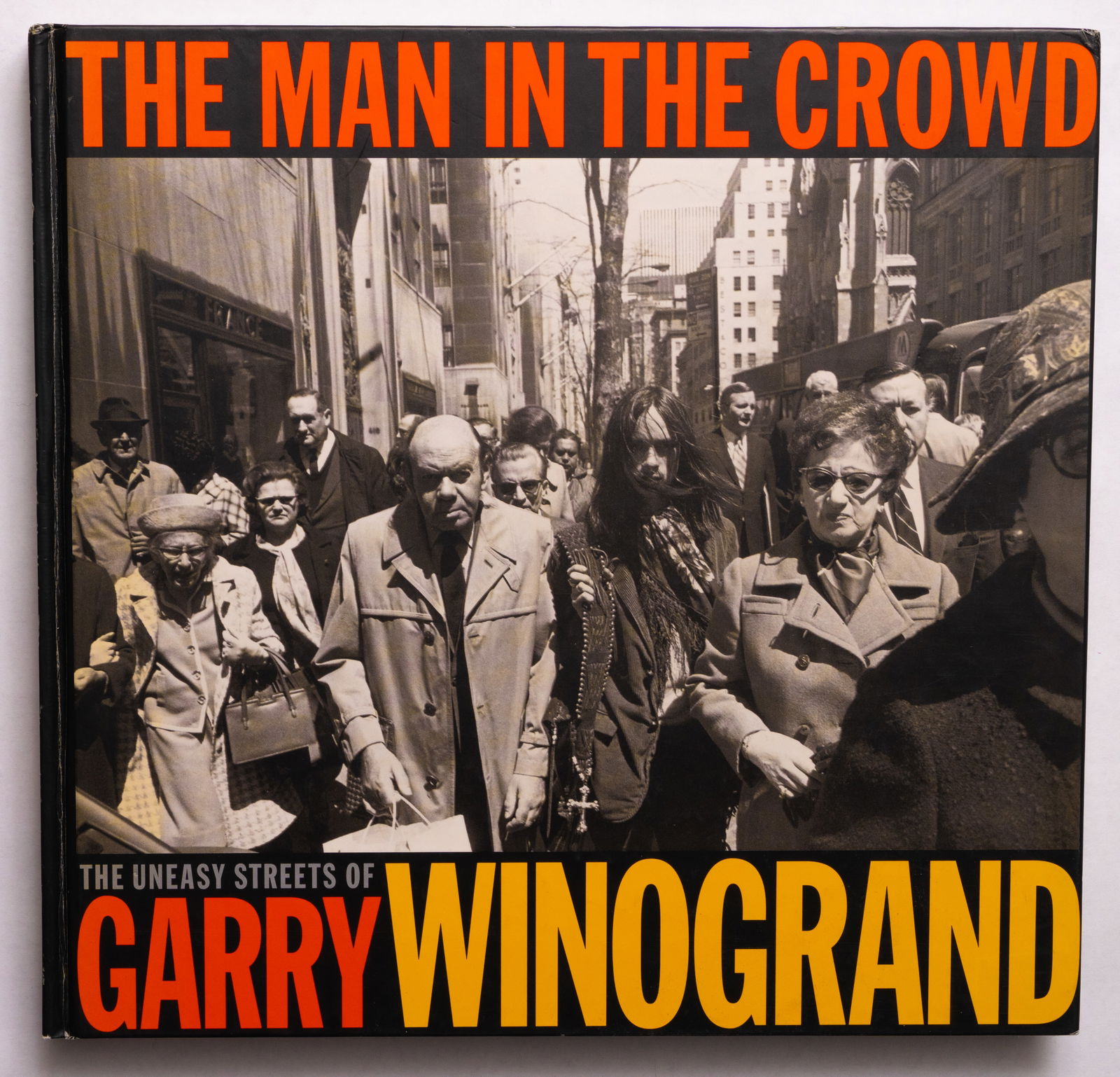 Winogrand, Gary; The Man in the Crowd The Streets of Garry Winogrand [1999 1ST EDITION & 1ST: Fraenkel Gallery in association with D.A.P/ Distributed Art Publishers, San Francisco, CA and New York 1999. Hardcover in pictorial boards. First Edition, First Printing. 168 pages showcasing key phot