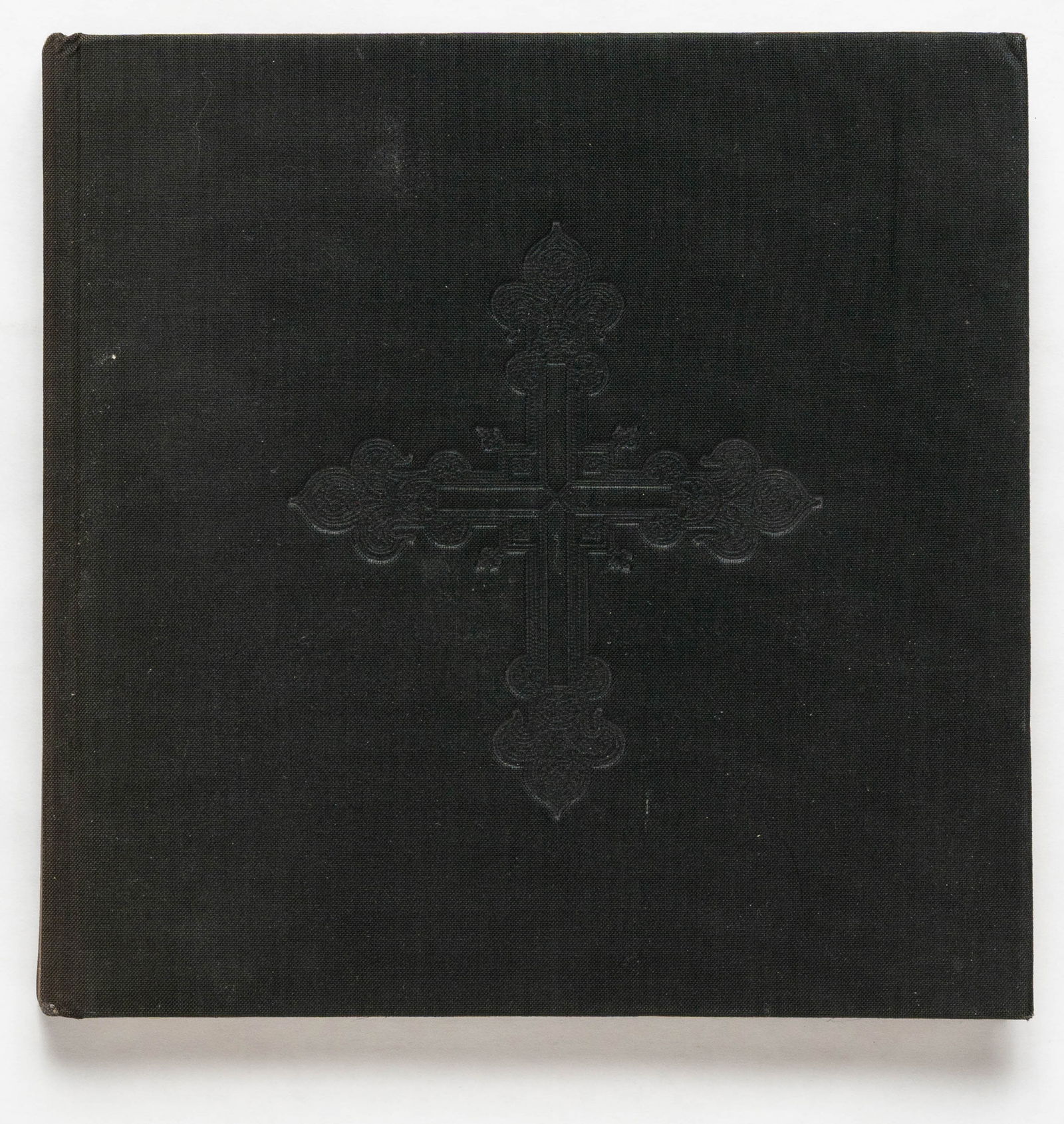Joel-Peter Witkin [SIGNED 1989 Centro De Arte Reina Sofia MONOGRAPH]: Ministerio De Cultura, Spain & Centro De Arte Reina Sofia, Madrid, Spain, 1989. Hardcover in black moire silk-covered boards debossed with an elaborate gothic cross, 7 x 7 inches. 120 paged profusely
