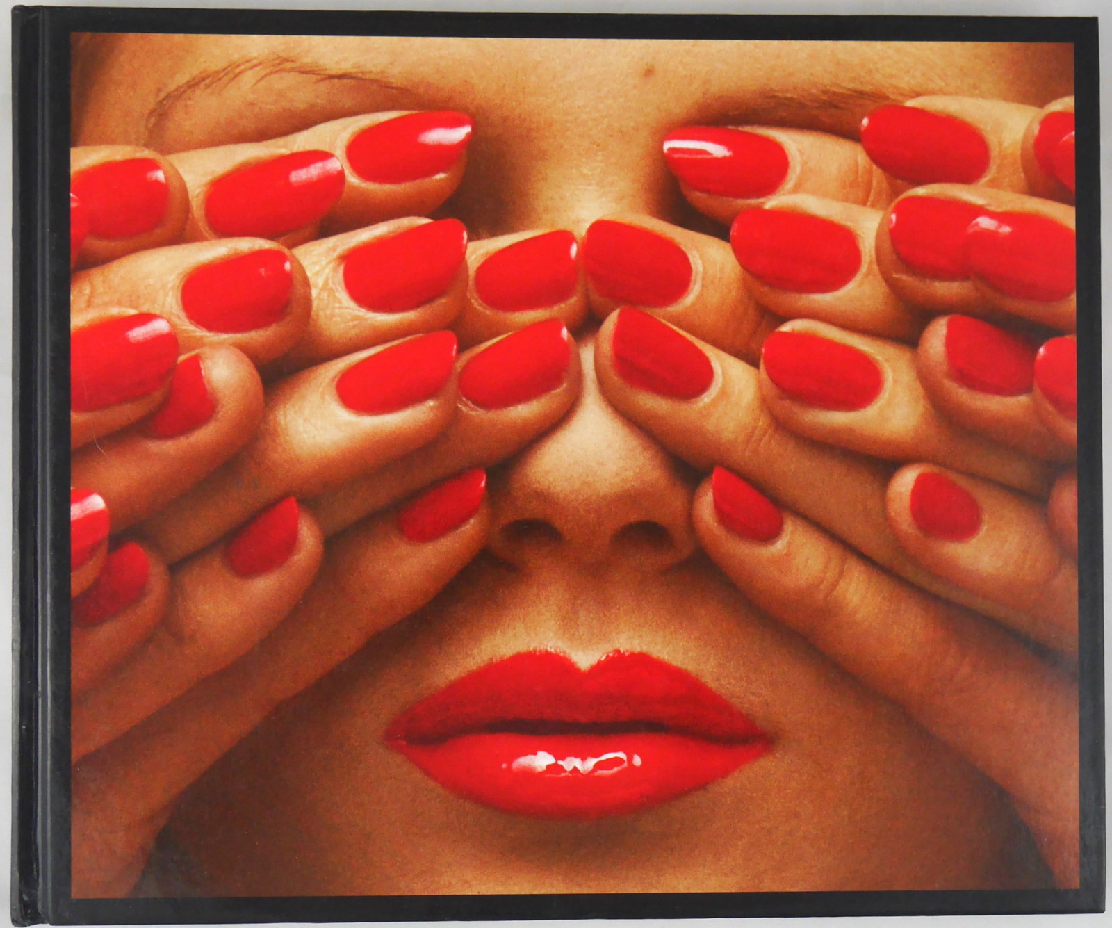 Bourdin, Guy; In Between [2010 1ST EDITION 1ST PRINTING - FINE]: Steidldangin, 2010. Hardcover in pictorial boards. First Edition, First Printing. 272 pages with numerous photographic images throughout. BOOK CONDITION: Fine; a tight, clean copy with light shelf wea