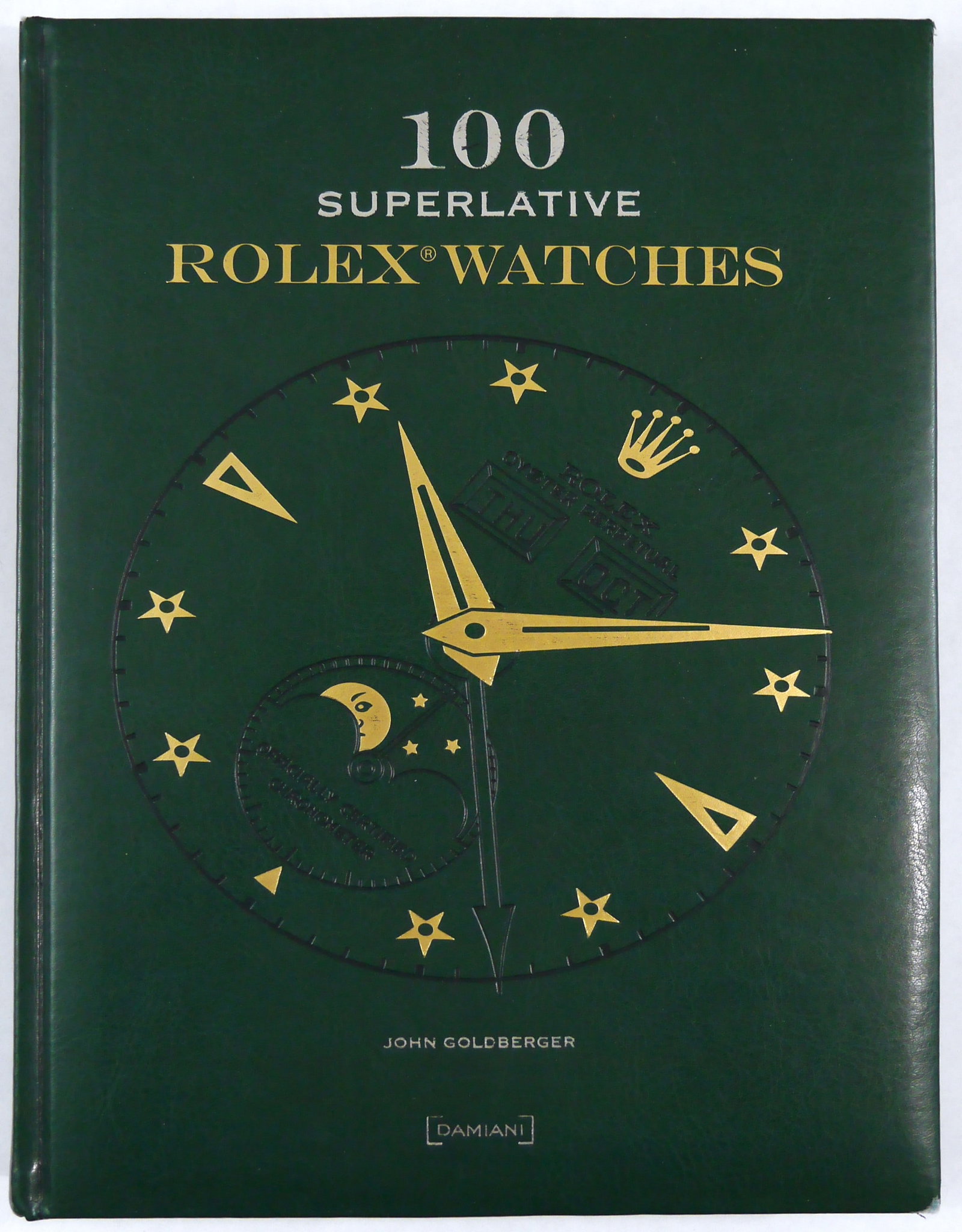 Goldberger, John and Negretti, Giampiero; 100 Superlative Rolex Watches [2008 1ST EDITION]: Bologna, Damiani, 2008. Hardcover in green faux leather covers with printed titles in silver and gold (lacking the slipcase). 4to. 264 pages with color photographic imagess throughout.? Issued on the 