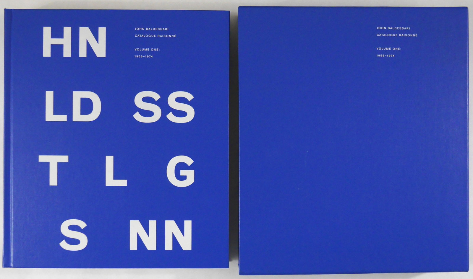 John Baldessari Catalogue Raisonne, Vol 1 [SIGNED - 1ST EDITION - FINE]: SIGNED COPY - Yale University Press, 2012. Hardcover with printed titled to front cover and spine housed in a matching blue cardboard slipcase. First Edition, First Printing. 12 x 11 inches. 472 pages