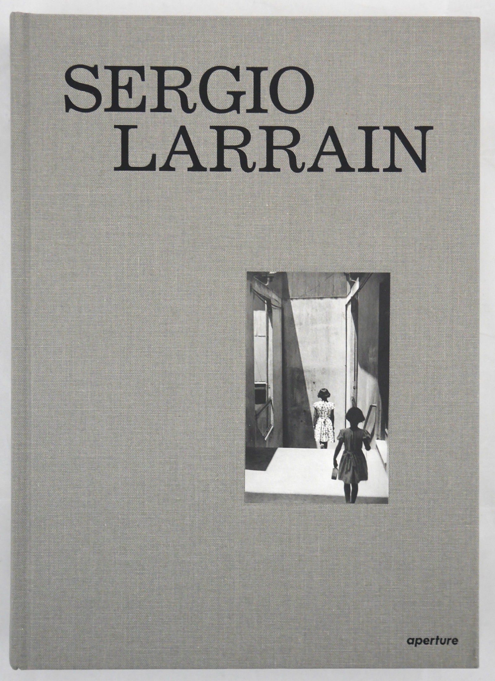 Sergio Larrain [RARE 2013 APERTURE MONOGRAPH]: Aperture, New York, 2013. Hardcover in cloth boards with tipped in images to front and rear board. First Edition, First Printing (with the full numberline ending in 1) 400 pages with over 200 black an