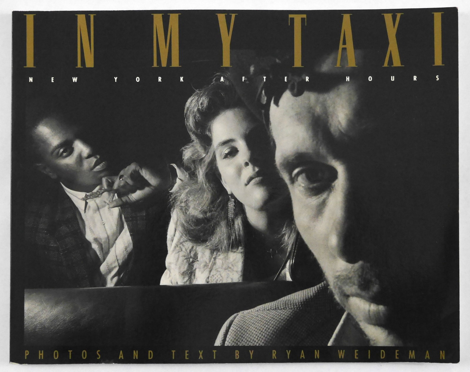 Weideman, Ryan; In My Taxi, New York After Hours [SIGNED 1993 1ST EDITION - FINE]: SIGNED COPY - Thunder's Mouth Press, 1993, Softcover in pictorial wrappers. First Edition, First Printing.? Unpaginated with circa 100 pages and about 80 photographic images in black and white through