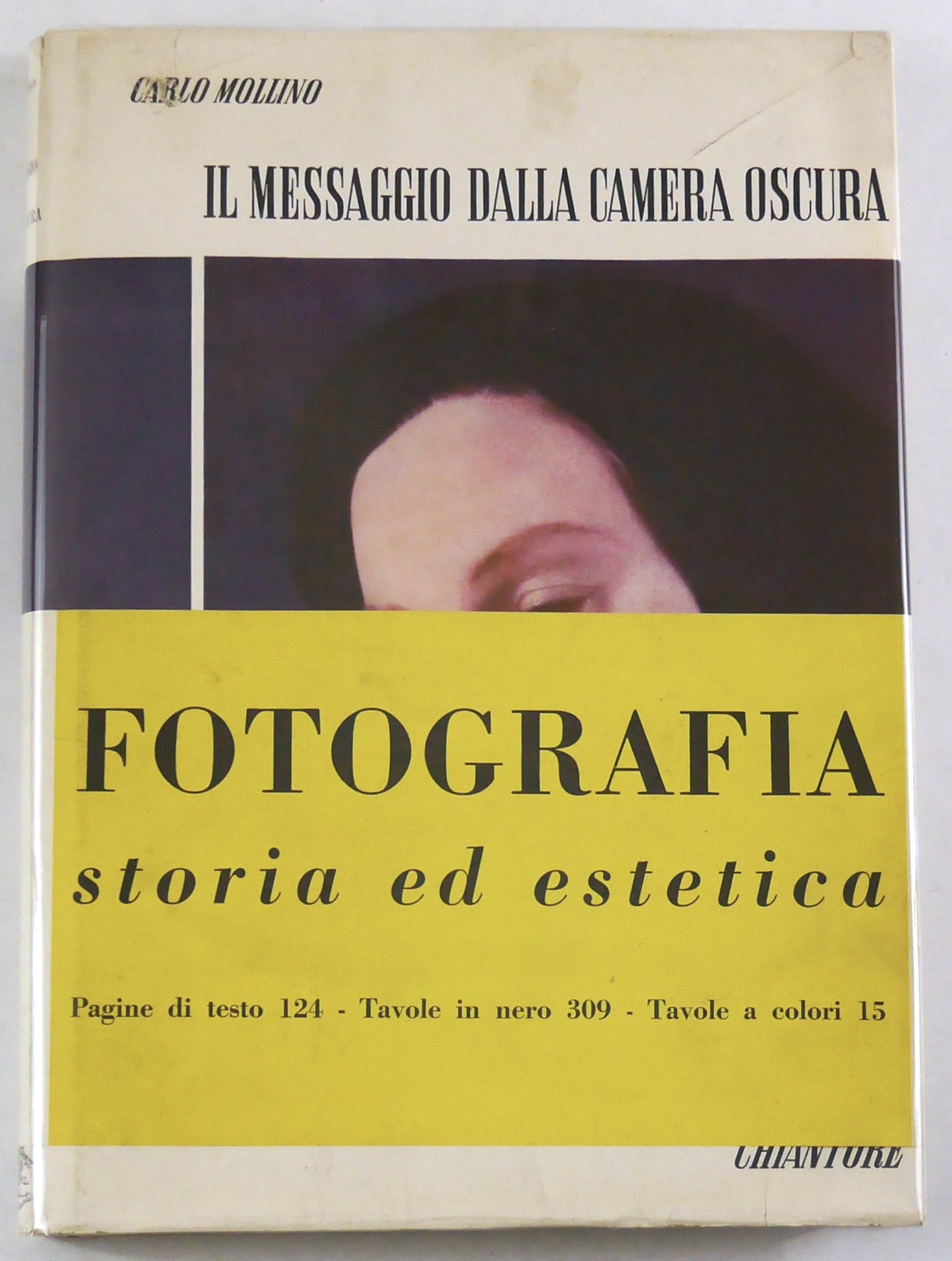 Mollino. Carlo; Messaggio Dalla Camera Oscura [RARE 1949 1ST EDITION WITH JACKET AND OBI - FINE]: Torino: Pressa la Casa Editrice Chiantore di Torino, 1949.? Hardcover in pictorial dust jacket with printed yellow wrap-around band/obi. First Edition. Large quarto. Text in Italian. 14 x 12 inches 44