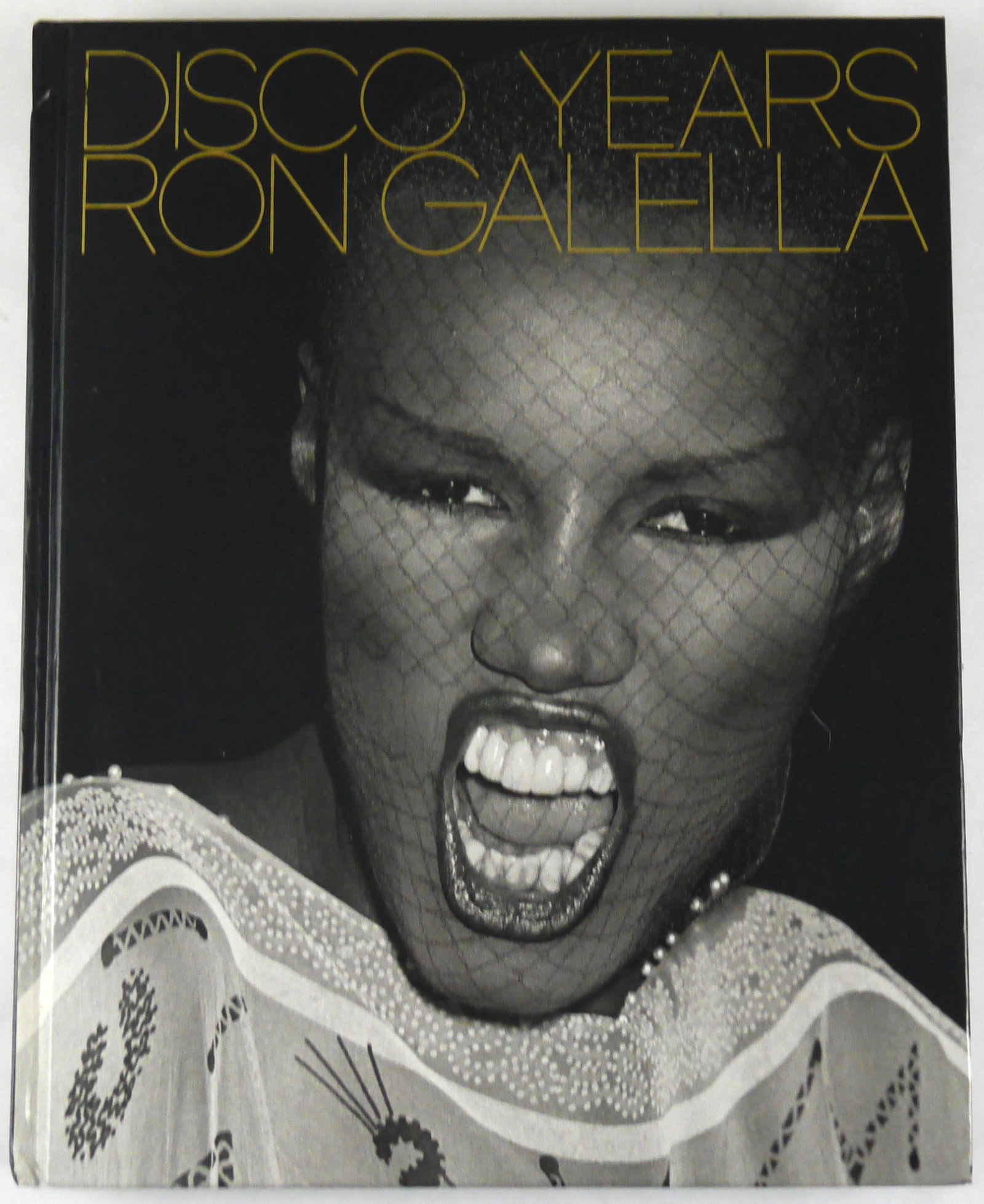 Galella, Ron; Disco Years [2009 1ST EDITION 1ST PRINTING HARDCOVER]: PowerHouse, 2006. Hardcover in pictorial boards. First Edition, First Printing (with full numberline ending in 1). 200 pages with numerous photographic images throughout by Ron Galella offering a visu