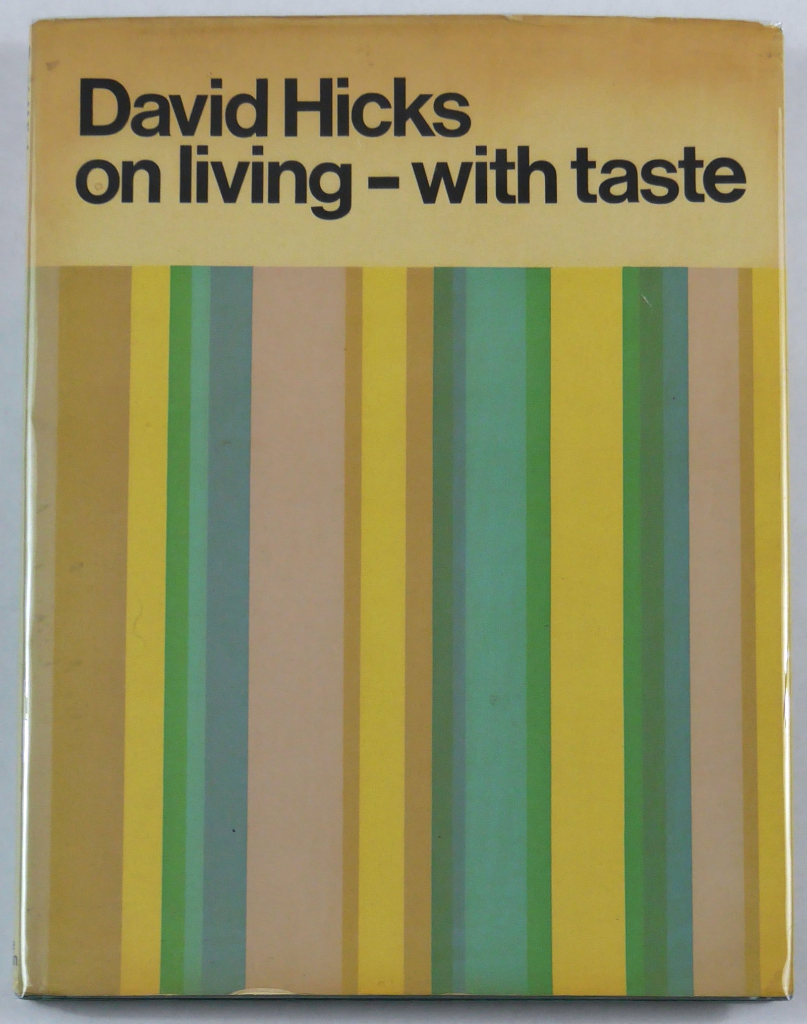 David Hicks On Living - With Taste [1968 1ST EDITION 1ST PRINTING WITH DUST JACKET]: Leslie Frewin. London. 1968. First Edition, First Printing. Hardcover in blue cloth-bound boards, green-blue-yellow stripy dust jacket. 150 pages with b&w and color photographs throughout taken by Dav