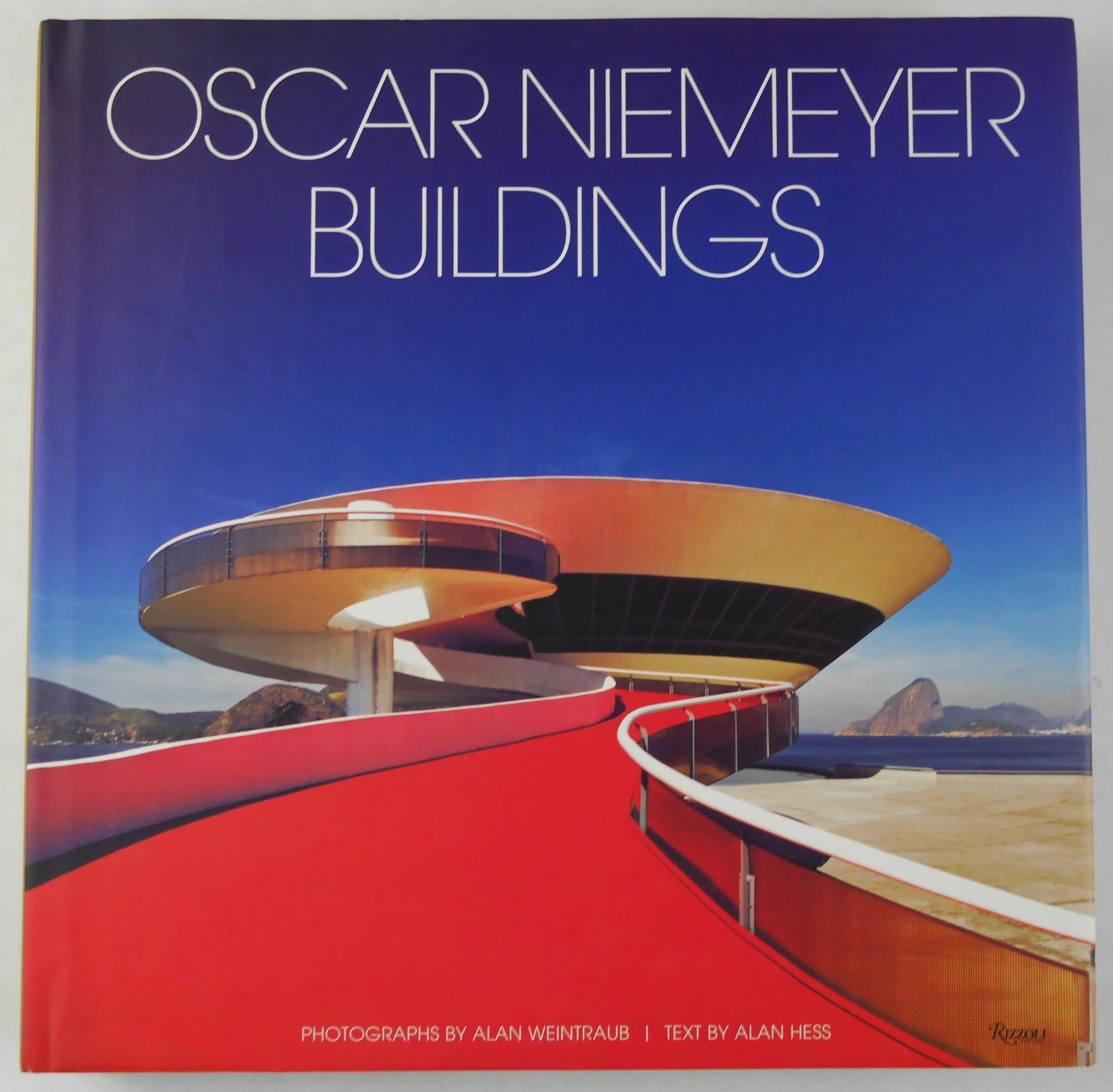 Oscar Niemeyer, Buildings [2009 Rizzoli Monograph - Fine]: NY: Rizzoli, [2009]. Hardcover in pictorial dust jacket. First edition, First Printing. Text by Alan Hess in English. Square folio, 11 x 11 inches. 367 pages filled with numerous color photographic im