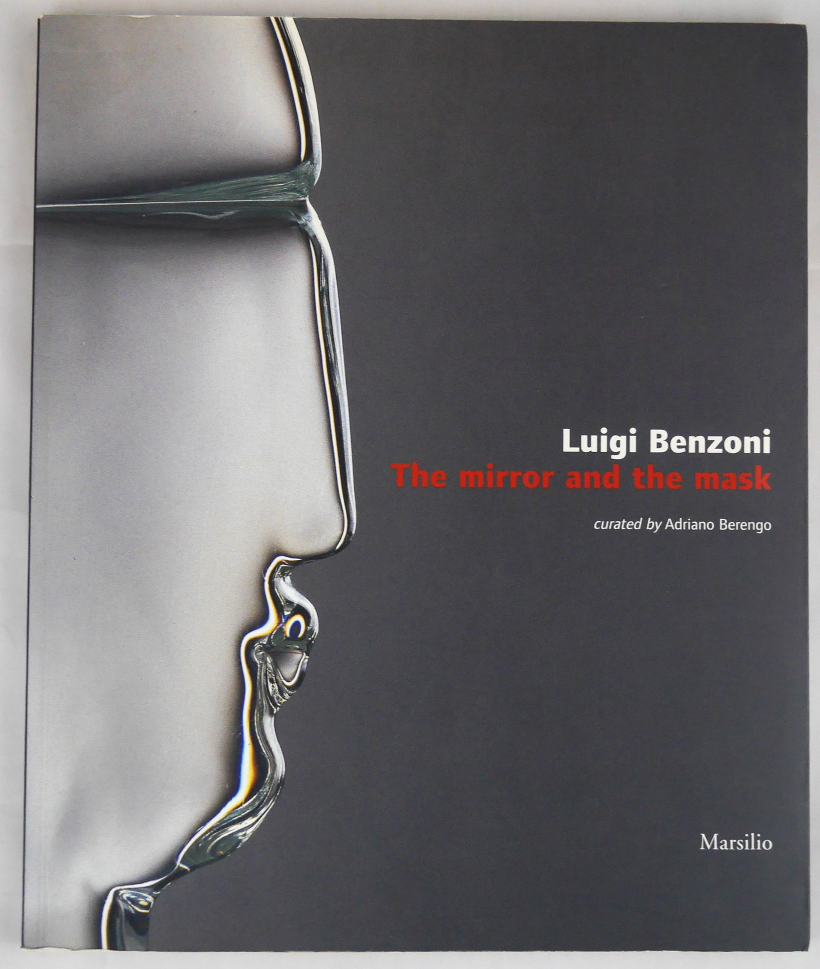 Benzoni, Luigi; The Mirror and The Mask [2005 1ST ED]: Marsilio, 2005. Softcover with pictorial wrappers. First Edition, Dec. 2005 (stated). 125 pages filled with numerous color photographic images (many full page) showcasing Benzoni's beautiful and thoug
