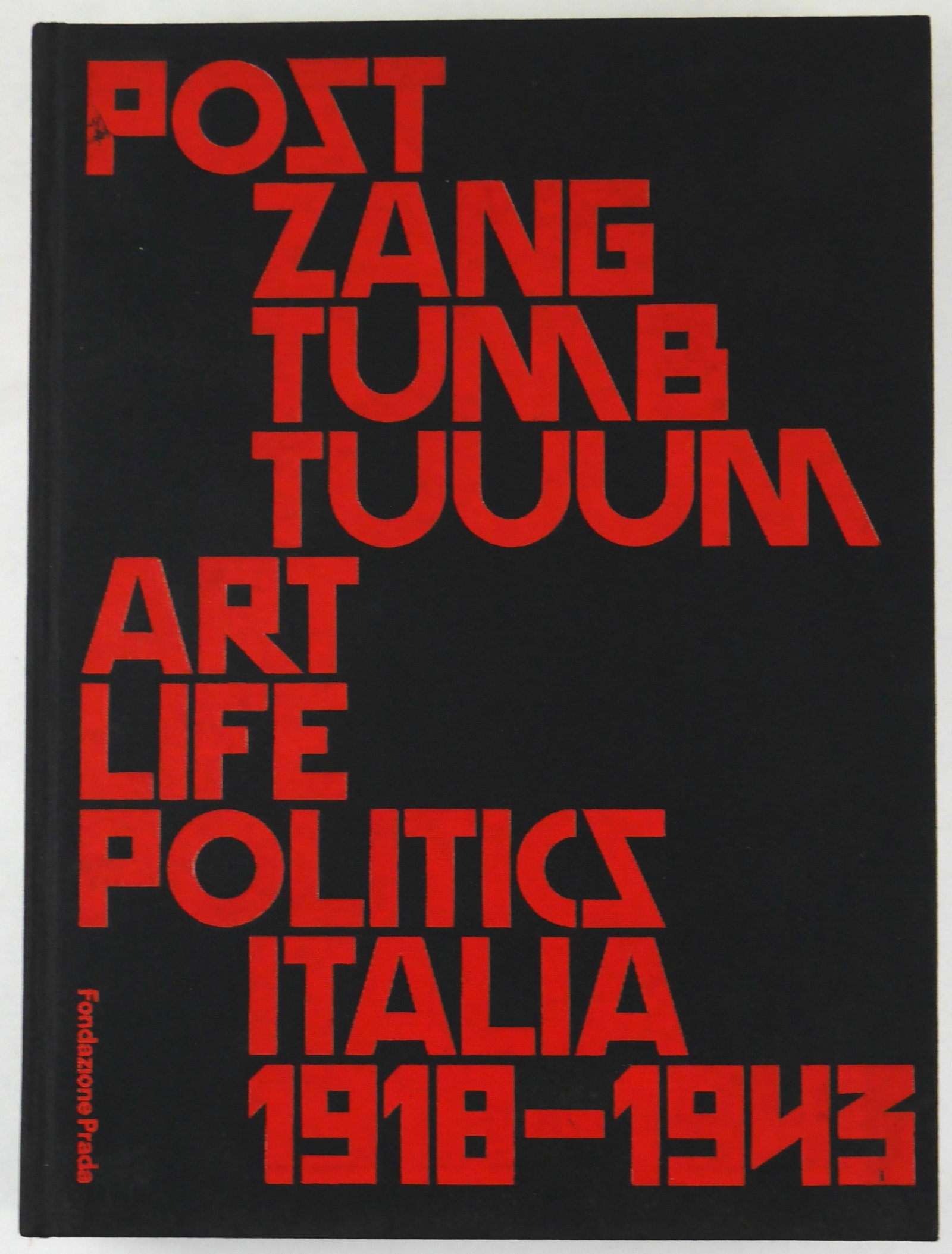 GERMANO CELANT POST ZANG TUUM ART LIFE POLITICS [2018 1ST EDITION - FINE COPY]: Fondazione Prada, 2018. Hardcover in cloth boards with title in red. First Edition, First Printing. 660 pages with numerous color and black and white photographic images and illustrations throughout. 