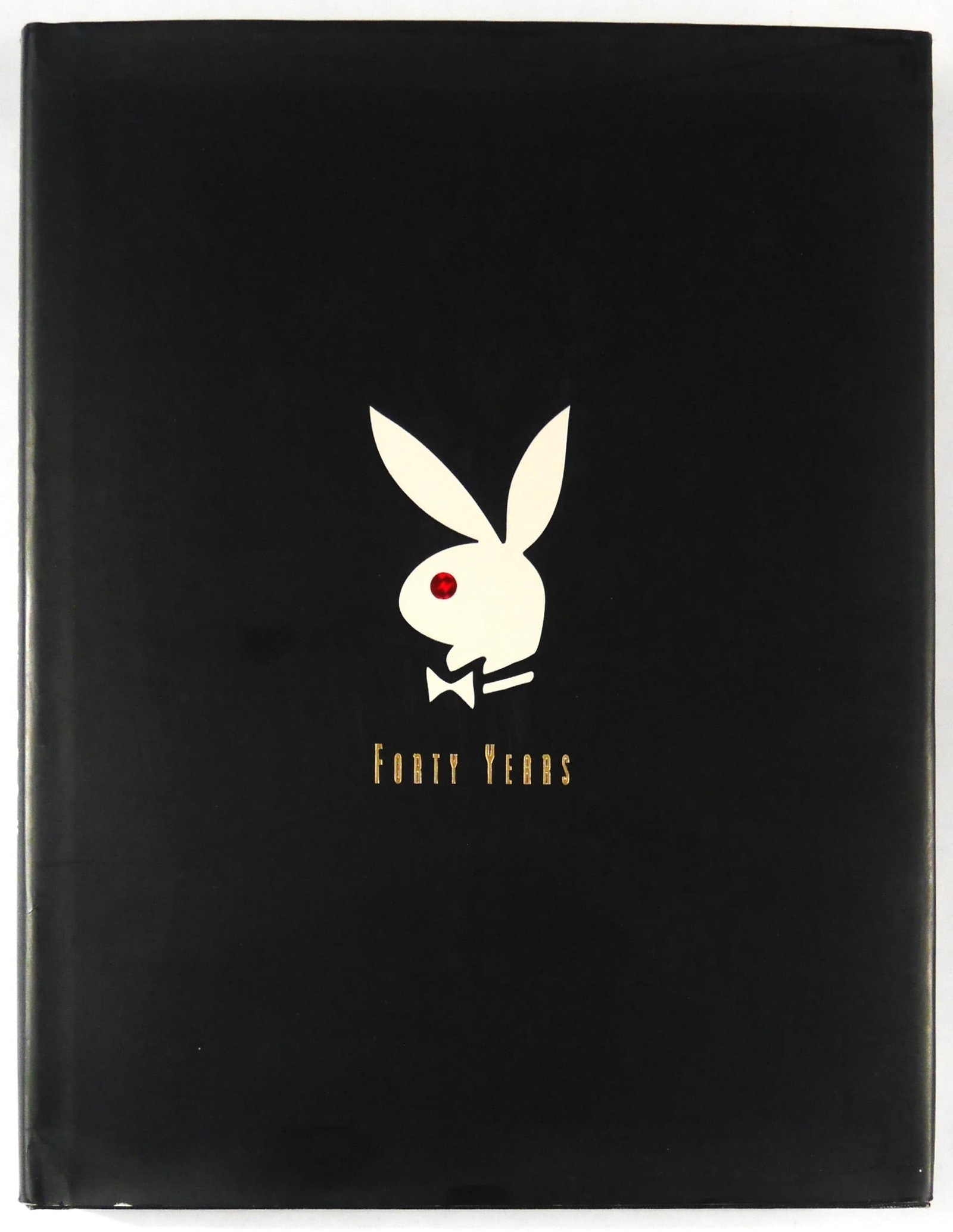 Hugh Heffner, The Playboy Book Forty Years [SIGNED - 1994 1ST EDITION 1ST PRINTING - FINE]: SIGNED COPY - General Publishing Group, 1994. Hardcover in printed black dust jacket. First Edition, First Printing (with the full numberline ending in 1). 13 x 11 inches. 368 pages filled with photog