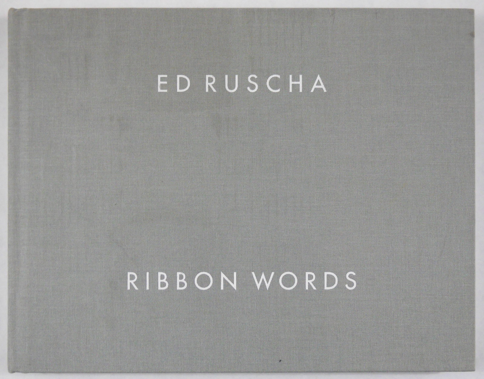 Edward Ruscha, Ribbon Words [SIGNED 2016 1ST EDITION]: SIGNED COPY - Edward Tyler Nahem Fine Art, 2016. Hardcover in gery cloth with titles printed in white. First Edition, First Printing.?11.25 x 8.75 inches.?104 pages offering a curated discussion and r