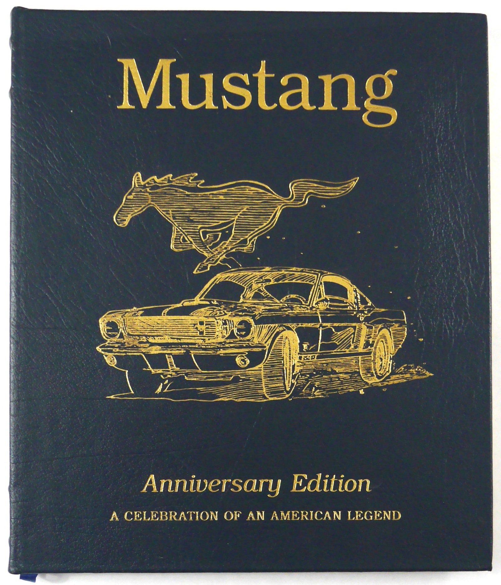 Caroll Shelby, Mustang 1964-1994 [SIGNED - LEATHER-BOUND SPECIAL ANNIVERSARY EDITION- FINE]: SIGNED LIMITED EDITION - Easton Press, 1996. Hardcover bound in full leather with titles, mustang logo and fastback car in gilt to front cover. First Edition Thus (previously published by Prion Books 