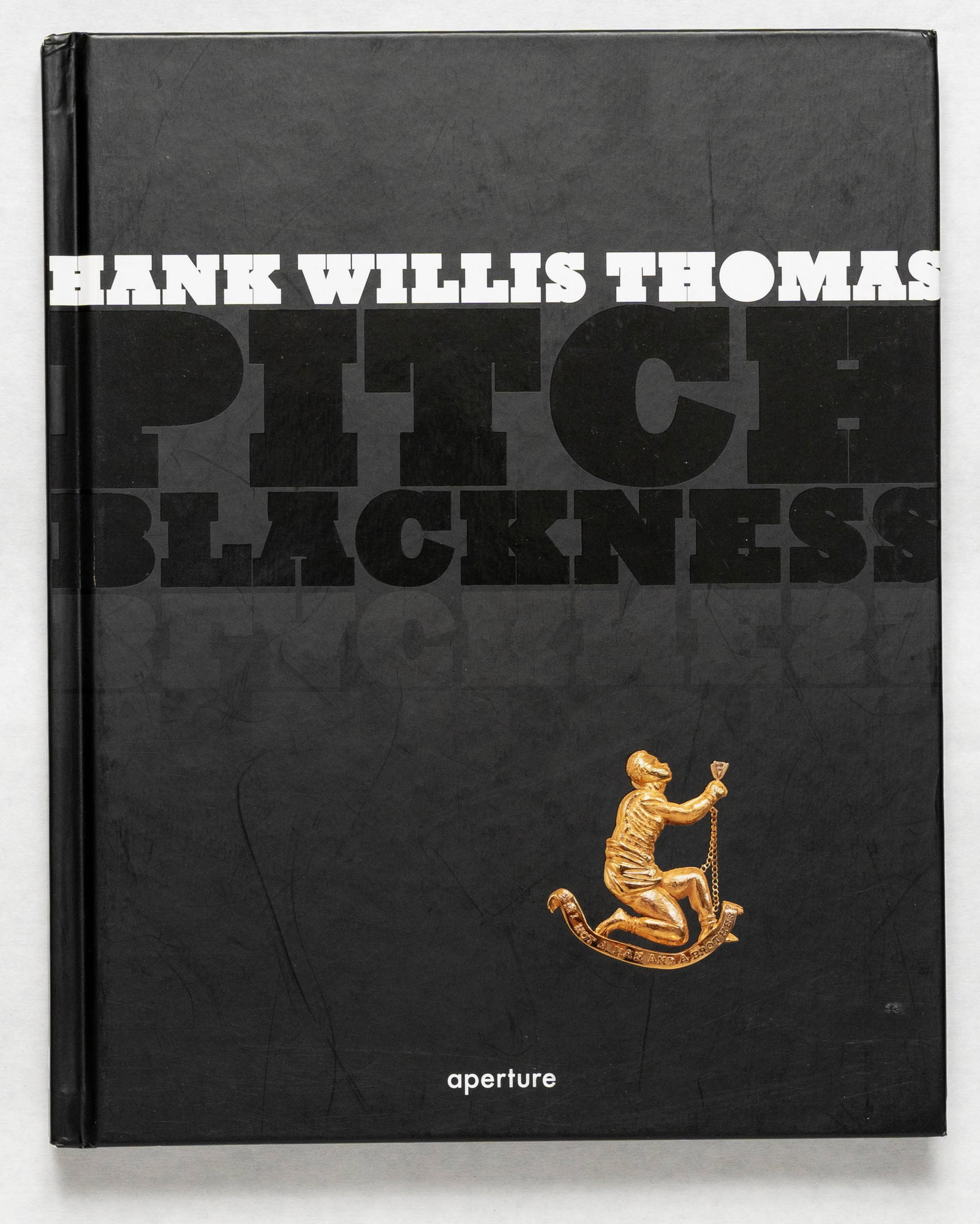 Thomas, Hank Willis; Pitch Blackness [2008 1ST EDITION & 1ST PRINTING - NICE COPY]: New York, NY: Aperture 2008.Hardcover in pictorial boards. First Edition, First Printing. 8.5 x 10.5 inches. 112 pages with numerous color photographic BOOK CONDITION: Near Fine; a solid, tight, brigh