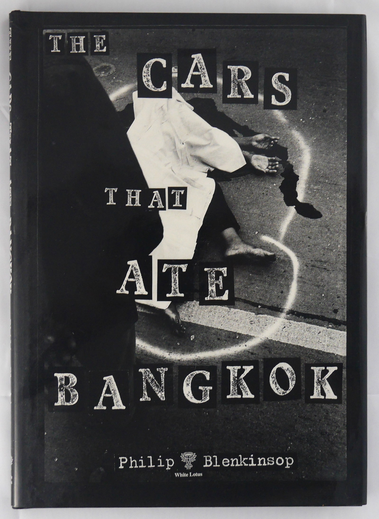 Blenkinsop, Phil; The Cars That Ate Bangkok [1996 1ST EDITION]: White Lotus 1996. Hardcover in pictorial dust jacket. First Edition, First Printing. Limited to only 1000 hand-numbered copies. 104 pages with numerous black & white photographic images throughout. Th