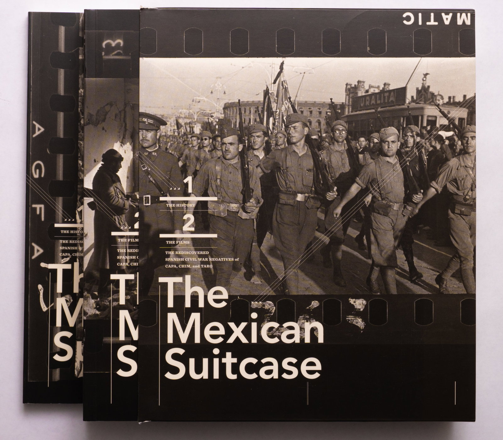 Capa, Robert; Seymour, David; Taro, Gerda; The Mexican Suitcase: The rediscovered Spanish Civil War: New York, ICP International Center of Photography / G?ttingen, Steidl, (2010).2 softcover volumes housed in thin paper slipcase. First Edition. Vol 1 with 192 pages. Vol 2 with 400 pages. With essays 