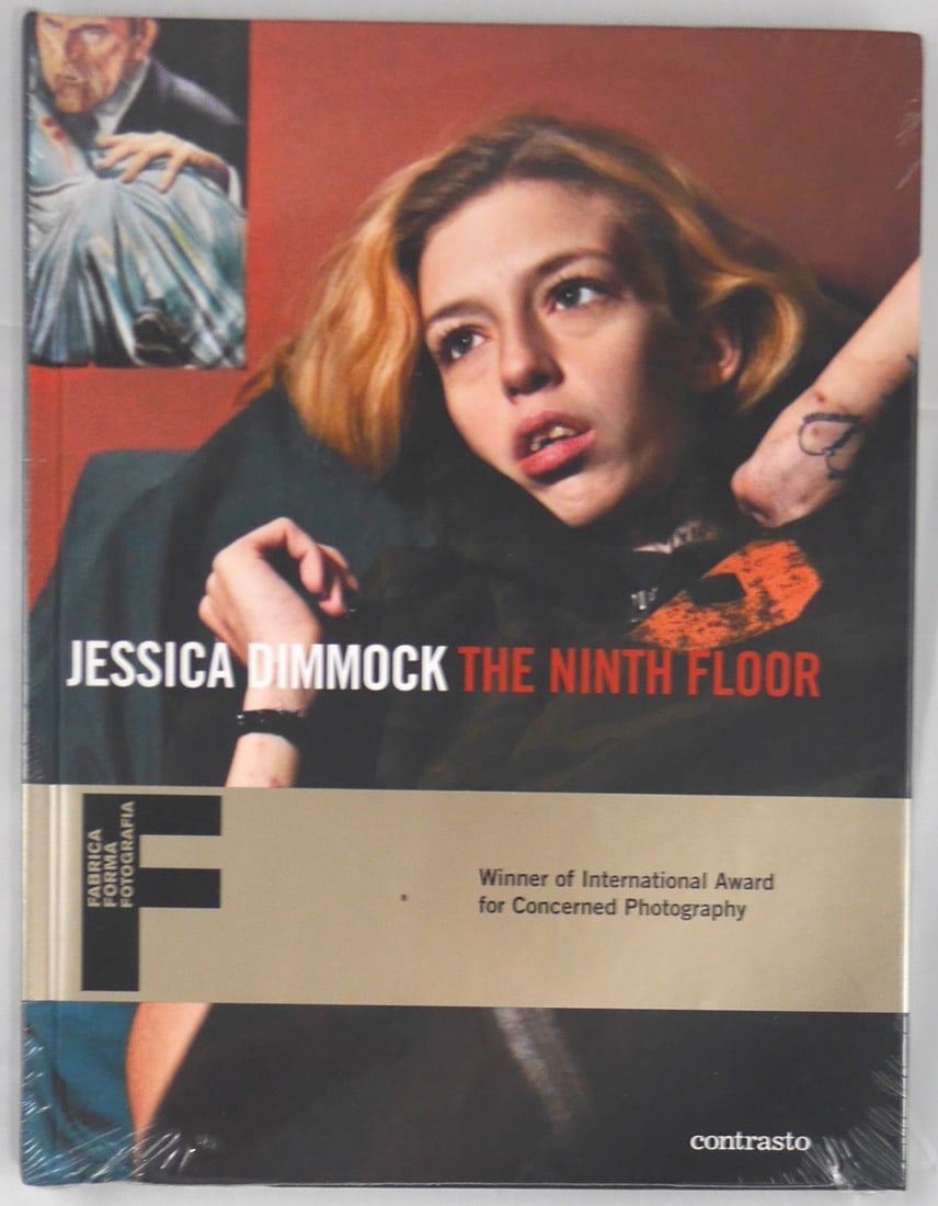Dimmock, Jessica; The Ninth Floor [SHRINKWRAPPED COPY]: Contrasto, 2007. Hardcover in pictorial boards with silver obi. First Edition, First Printing. 128 pages with numerous color photographic images throughout. Quarto (10.5 x 8 in./26.5 x 20 cm) Photogra