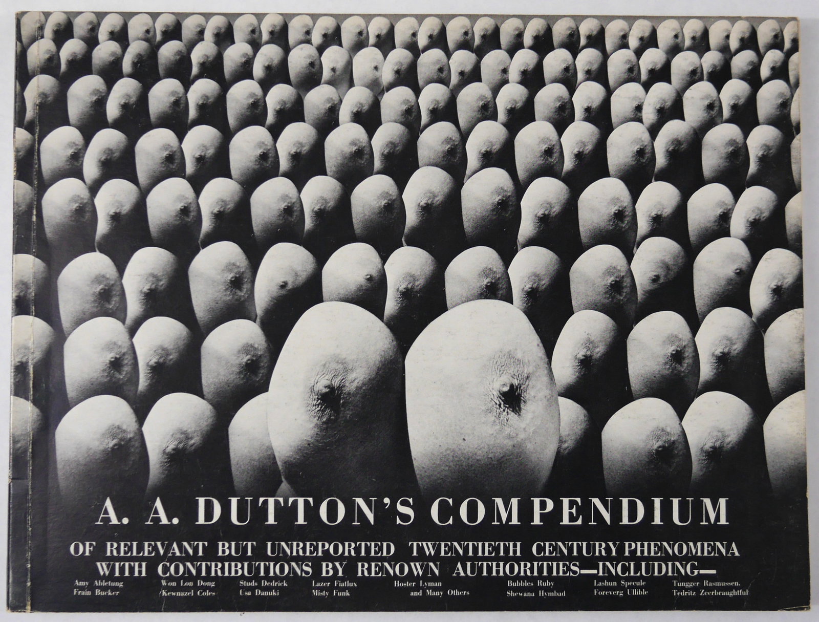A.A. Dutton's Compendium of Relevant but Unreported Twentieth Century Phenomena: Dutton/Buse, London, 1977. Softcover in pictorial wrappers. First Edition. 12 x 9 inches. 152 pages with 70 surrealistic photographic montages mixing landscapes, architecture and nude bodies in black 