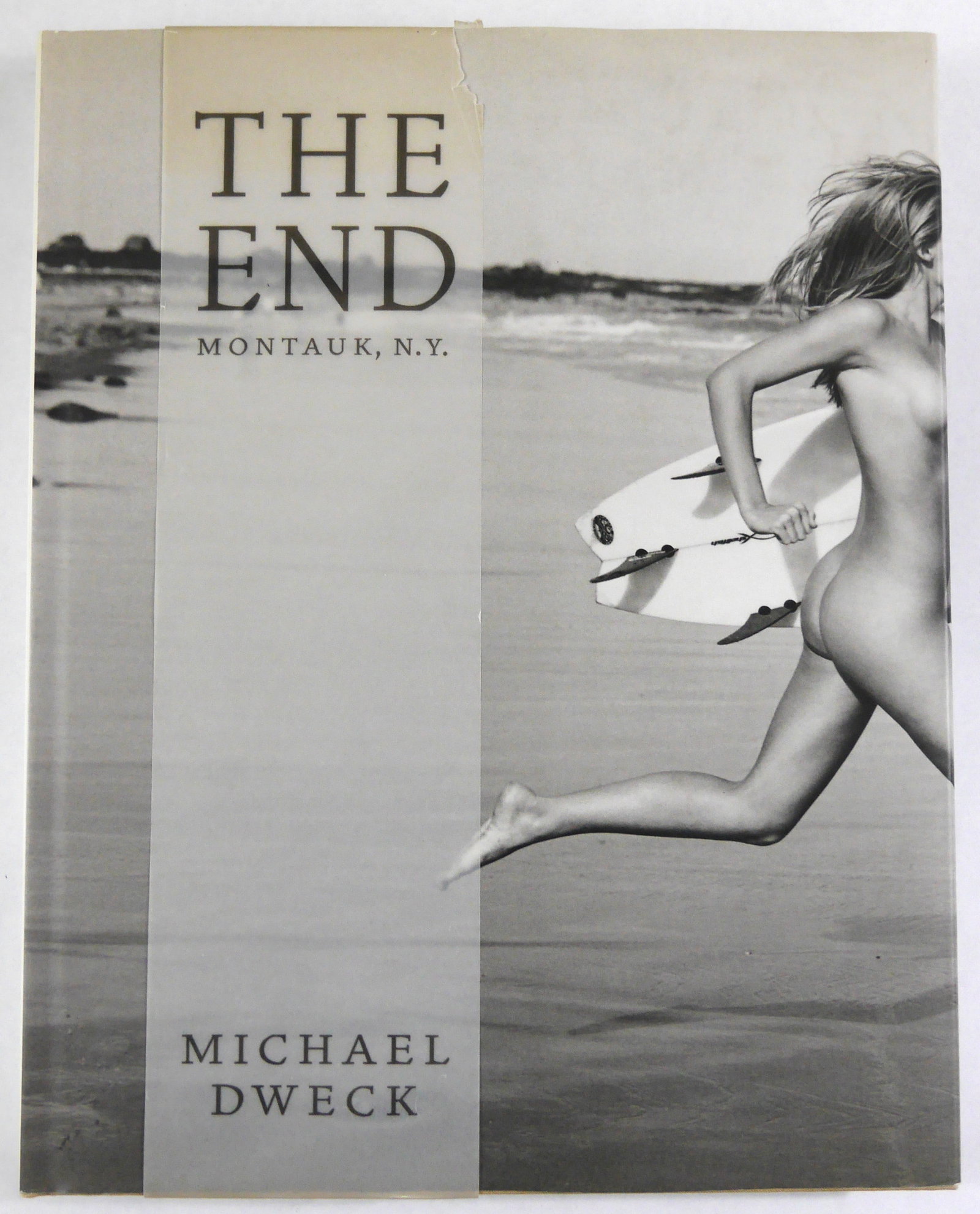 Dweck, Michael; The End Montauk N.Y. [SIGNED - RARE 2004 1ST EDITION - FINE]: Harry H. Abrams, 2004. Hardcover in pictorial dust jacket and wrap-around vellum band. Stated First Edition (First Printing). 200 pages with 201 duotone and 15 color illustrations. Designed by Jeremy 