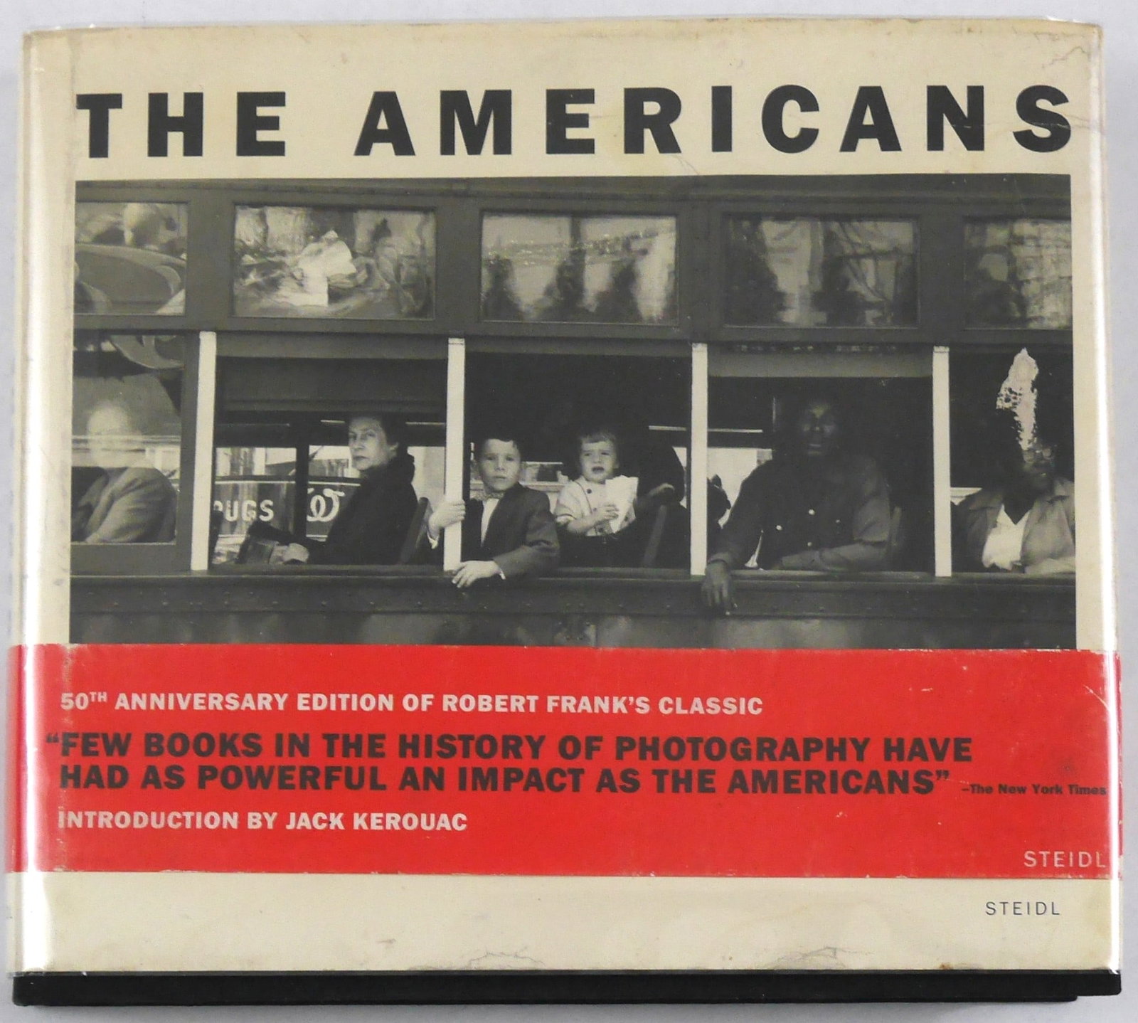 Frank, Robert; Americans [2008 Steidl 1ST EDITION WITH RED BAND]: Gottingen, Germany: Gerhard Steidl Druckerei Und Verlag, 2008. Hardcover in pictorial dust jacket and red wrap-around band. First Edition (stated), First Printing of the Steidl reissue. 180 pages with