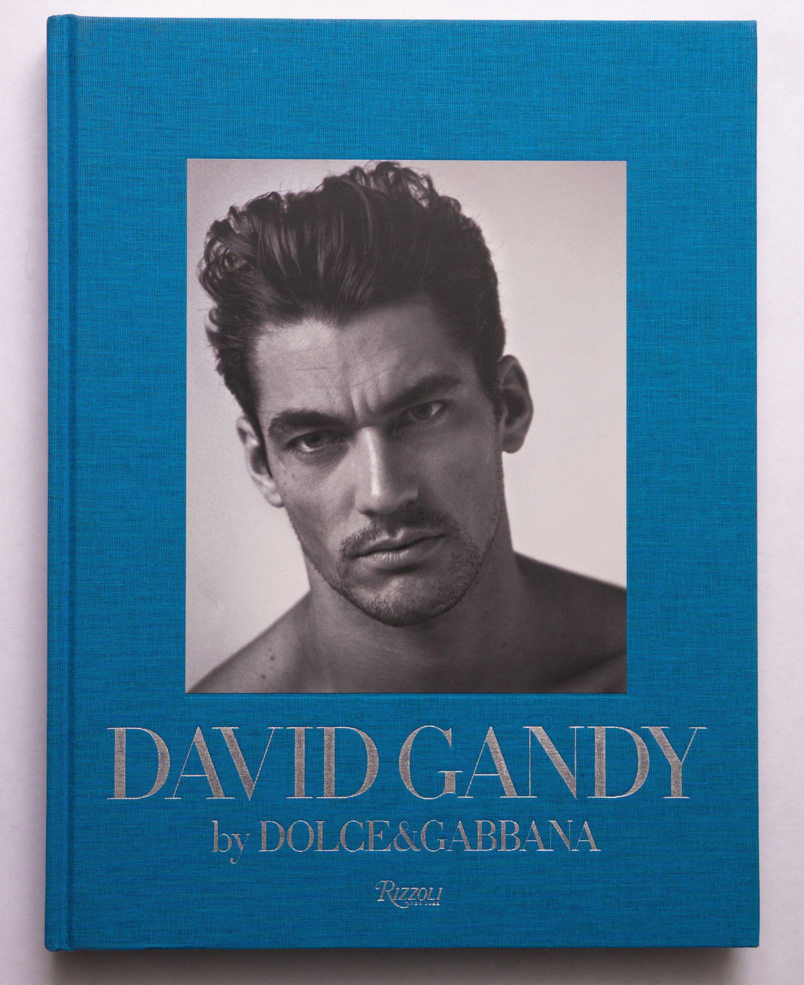 David Gandy by Dolce and Gabbana photographed by Mariano Vivanco [2011 RIZZOLI 1ST ED 1ST PRINTING]: Rizzoli, New York, June 2011. Hardcover in cloth boards with photograph tipped on to front cover. First Edition, First Printing with the full numberline ending in 1. 14 x 11 inches. 281 pages packed w