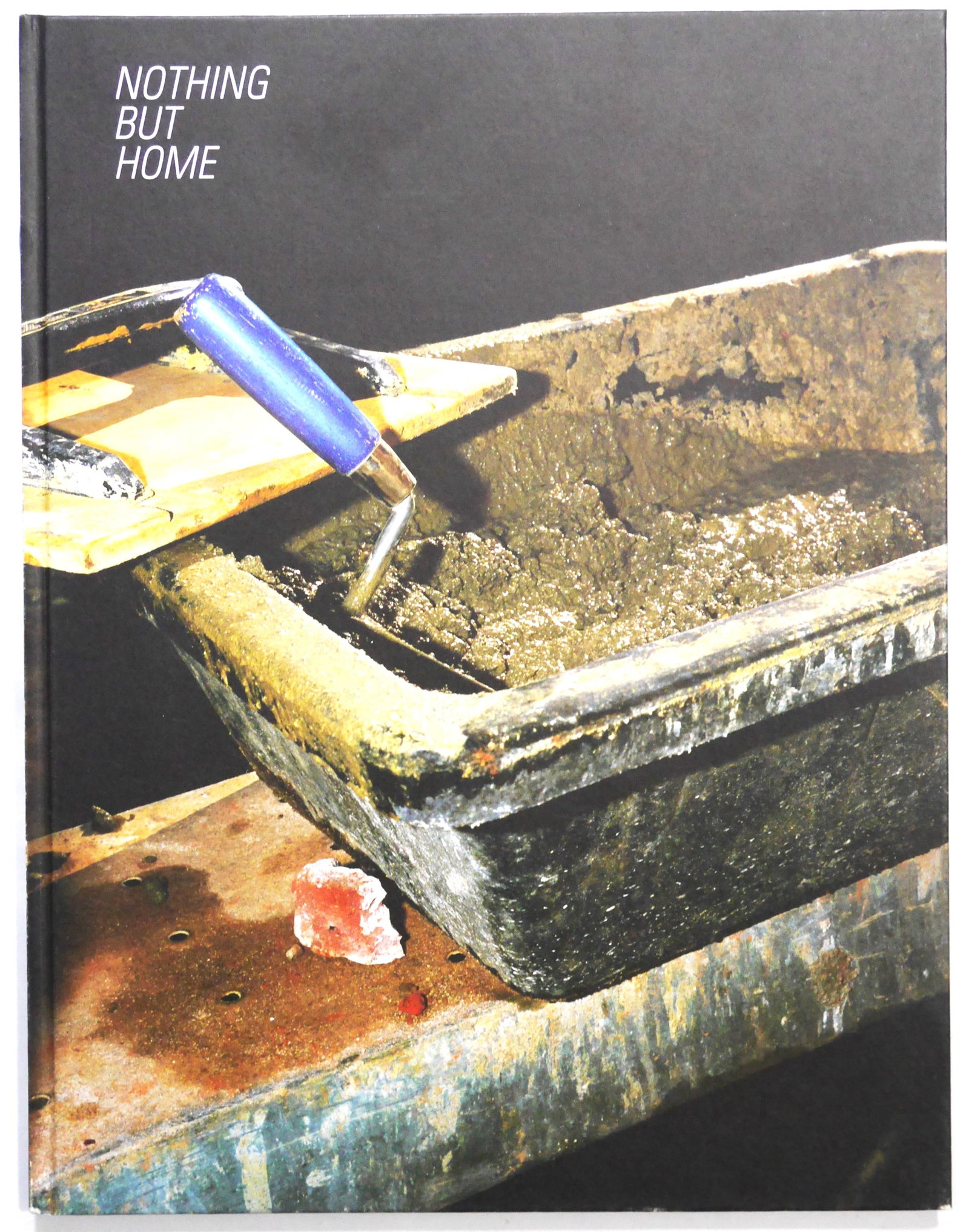 Girard, Sebastien; Nothing but Home [SIGNED]: SIGNED COPY Self Published, Toulouse, France. 2009. Hardcover. First Edition, First Printing. 4to. Text in English and French. 48 pages. Numerous colour plates. SIGNED on the title page in black ink b