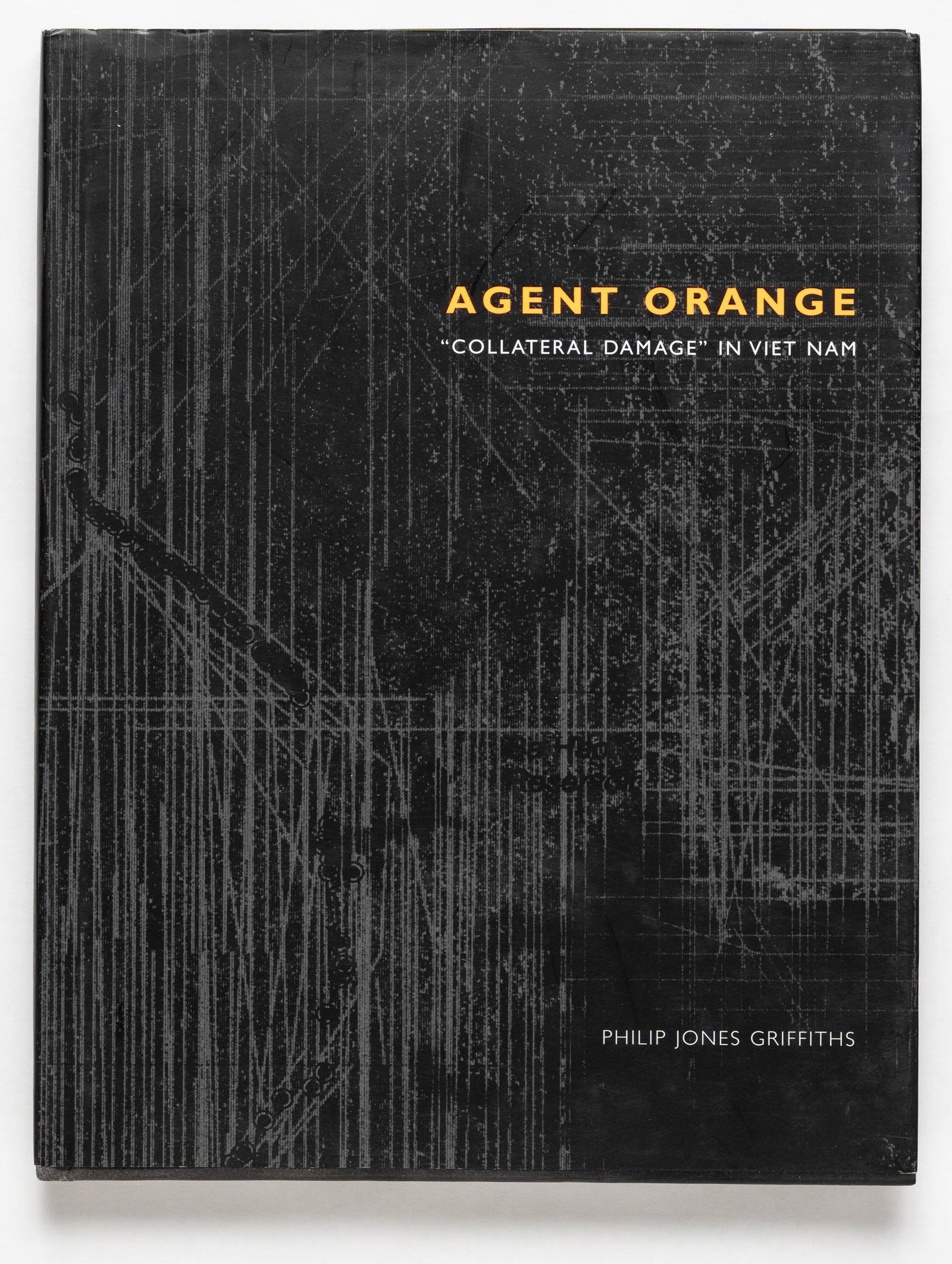 Griffiths, Philip Jones; Agent Orange, "collateral Damage" in Viet Nam [SIGNED 2003 1ST EDITION: SIGNED COPY - Trolley, 2003. Hardcover in printed dust jacket. First Edition, First Printing. 11 x 9 inches. 176 pages with numerous black adn white photographic images throguhout detailing the harsh 