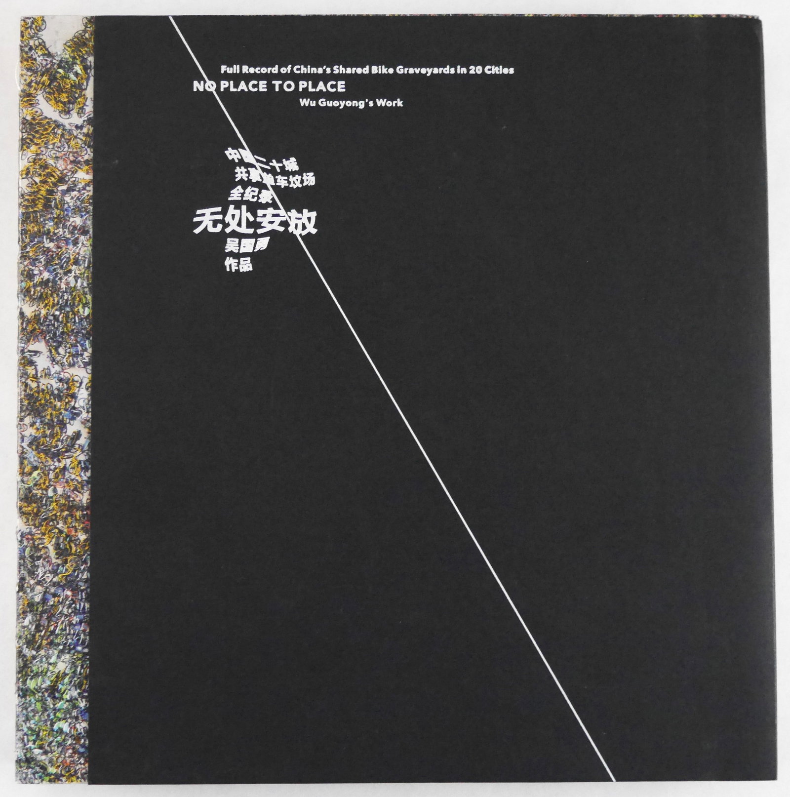 Guoyong, Wu;No Place to Place: China's Shared Bike Graveyards in 20 Cities SIGNED 1ST LTD ED PRINT: 2018, Paparback with black fold-over cover and open sewn binding housed in white, thick cardboard slipcase. First Edition, First Printing. Limited Edition of only 500 individually numbered and SIGNED 