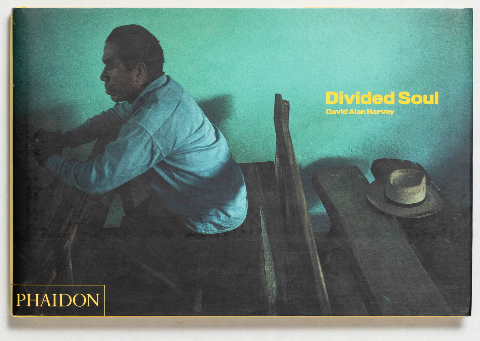 Harvey, David Alan; Divided Soul [SIGNED - 2003 1ST EDITION & 1ST PRINTING - FINE COPY]: SIGNED COPY - Phaidon, 2003. Hardcover in pictoirial dust jacket. First Edition, First Printing. 164 pages with color photographic images throughout offfering the viewer a visual essay on the Spanish 