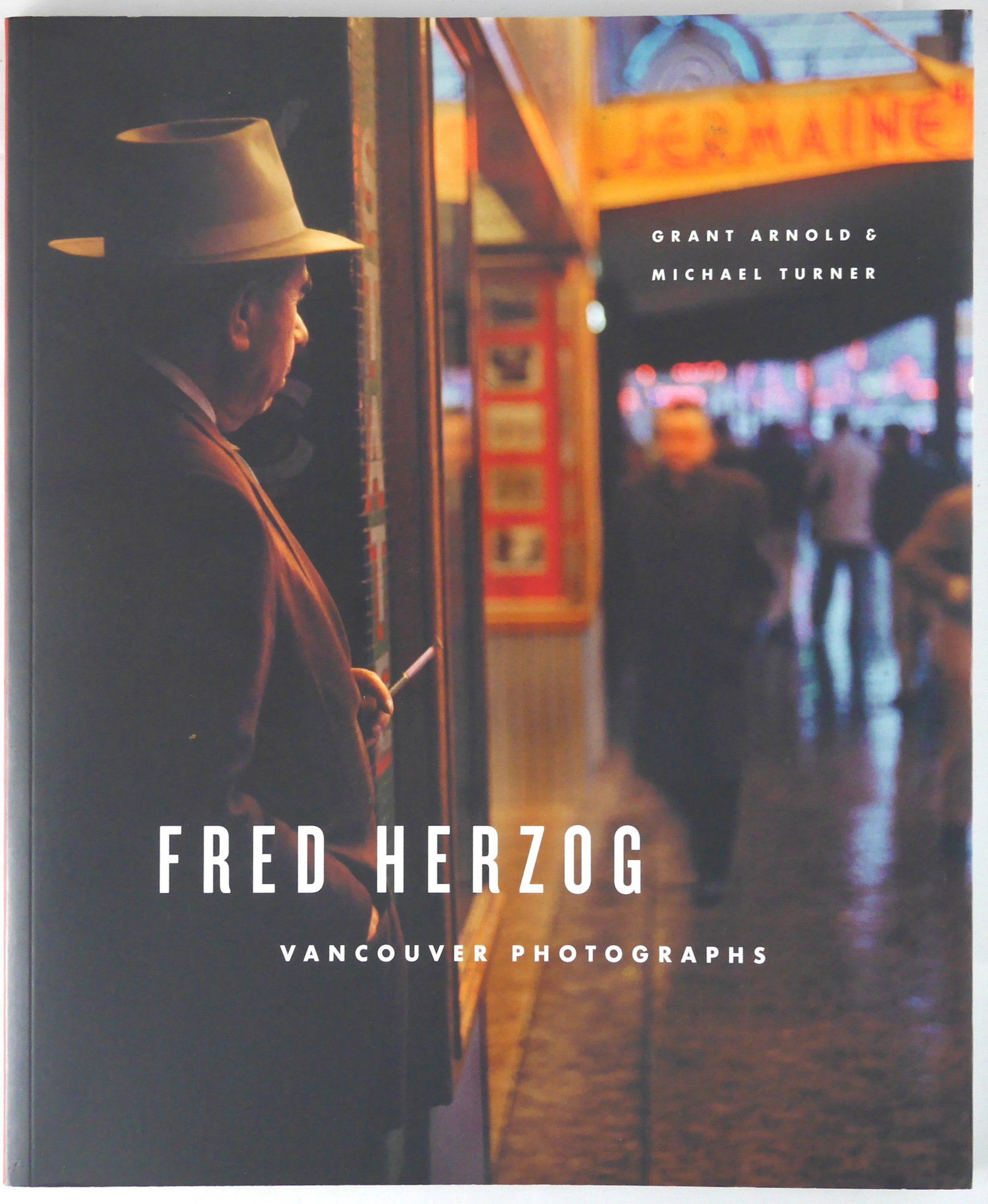 Herzog, Fred; Vancouver Photographs [1ST EDITION & 1ST PRINTING - FINE COPY]: Vancouver Art Gallery 2007. Softcover in pictorial wrappers. First Editon, First Printing (with full number line ending in 1).160 pages with numrous color photographs throghout. BOOK CONDITION: Fine; 