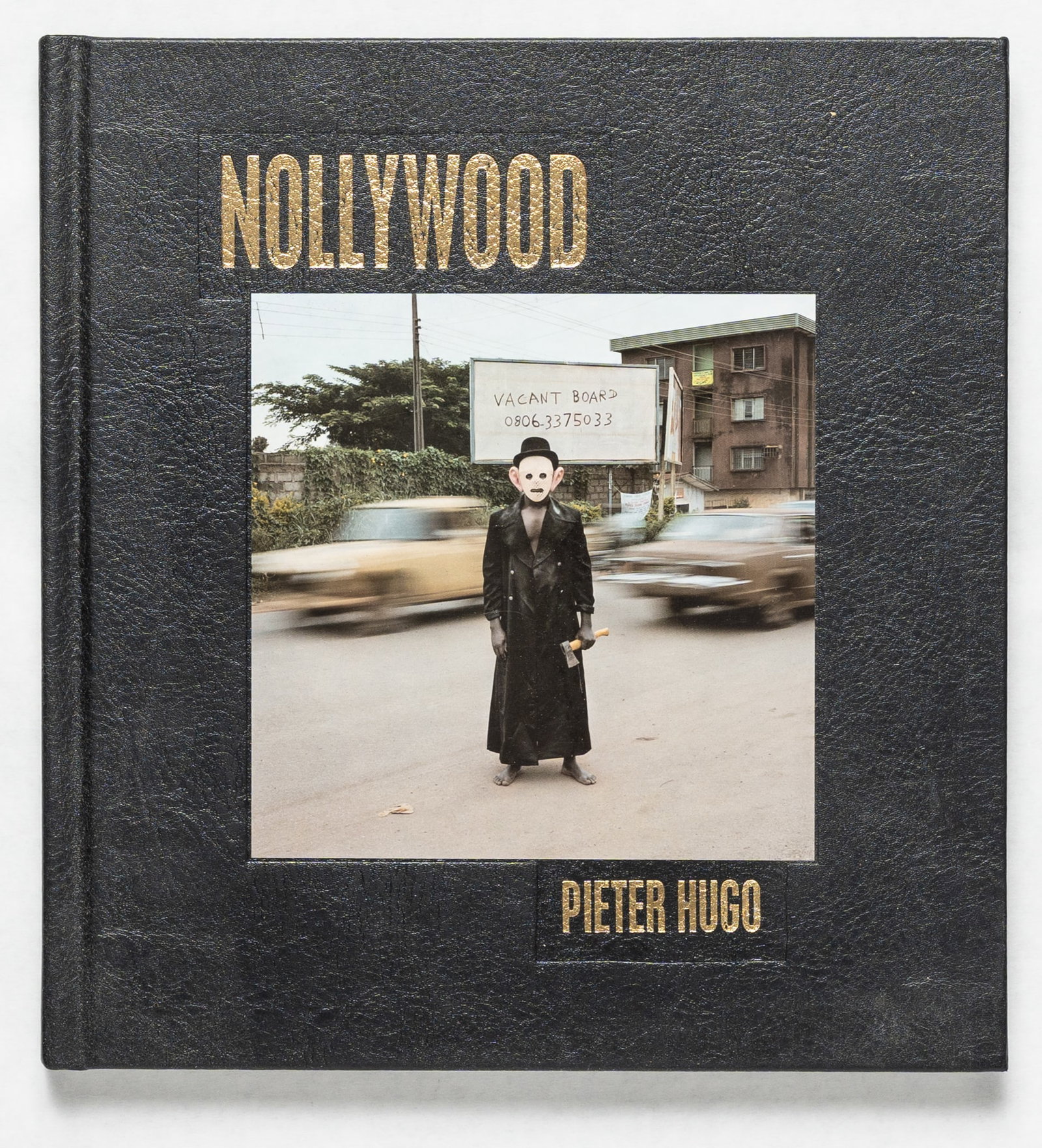 Hugo, Pieter; Nollywood [2009 1ST EDITION & 1ST PRINTING - FINE COPY]: Prestel Verlag, Munich and New York, 2009. Hardcover. First edition, first printing. Black leather covered boards with tipped-in four-color plate on cover and title stamped in gold on cover and spine;