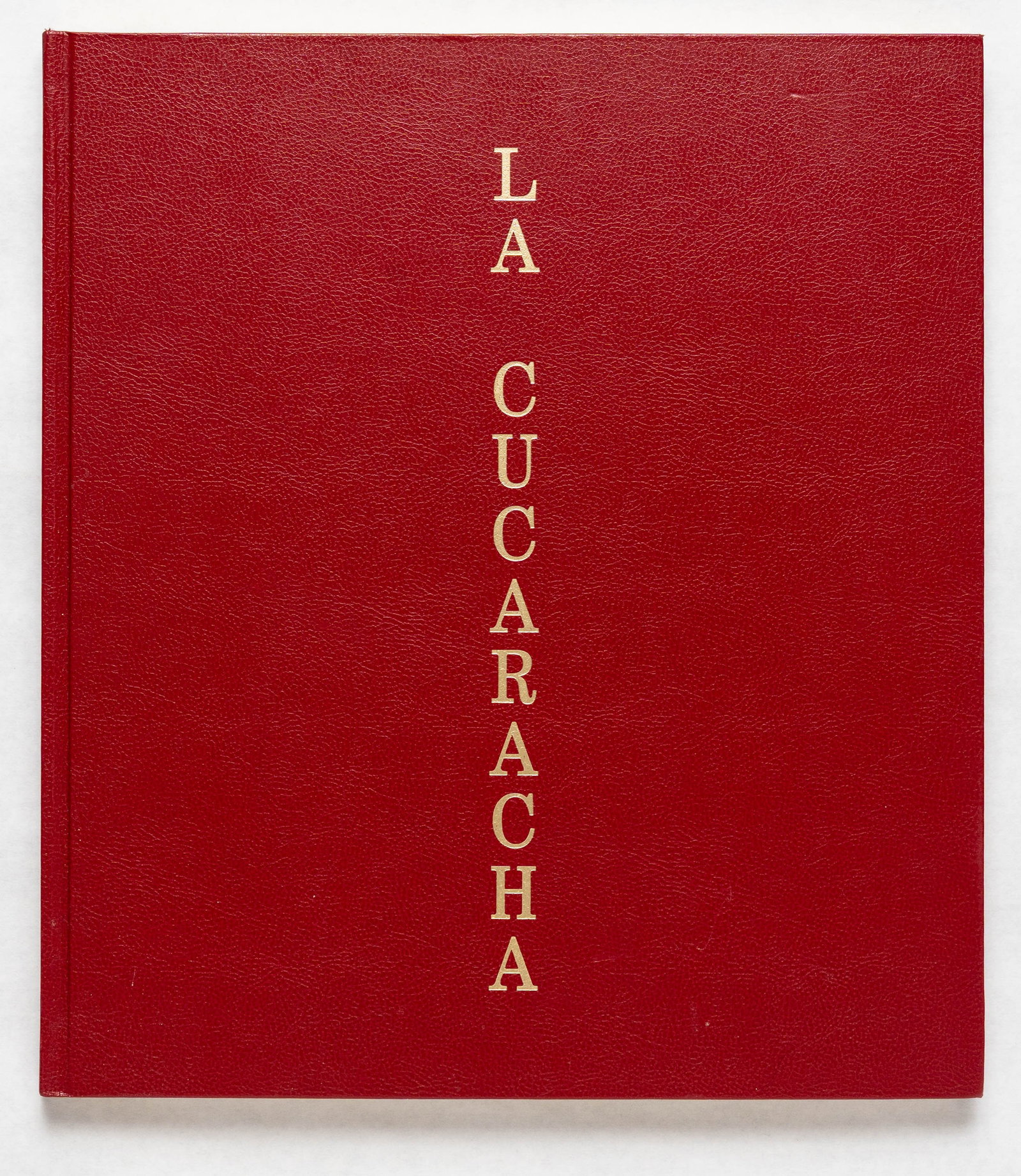 Hugo, Pieter; La Cucaracha [SIGNED 2019 1ST EDITION 1ST PRINTING - FINE]: RM Verlag, 2019. Hardcover in leatherette boards. First edition and first printing. 14 x 12 inches. 130 pages with 56 color photographs by Pieter Hugo taken throughout Mexico. Features texts by Mario 