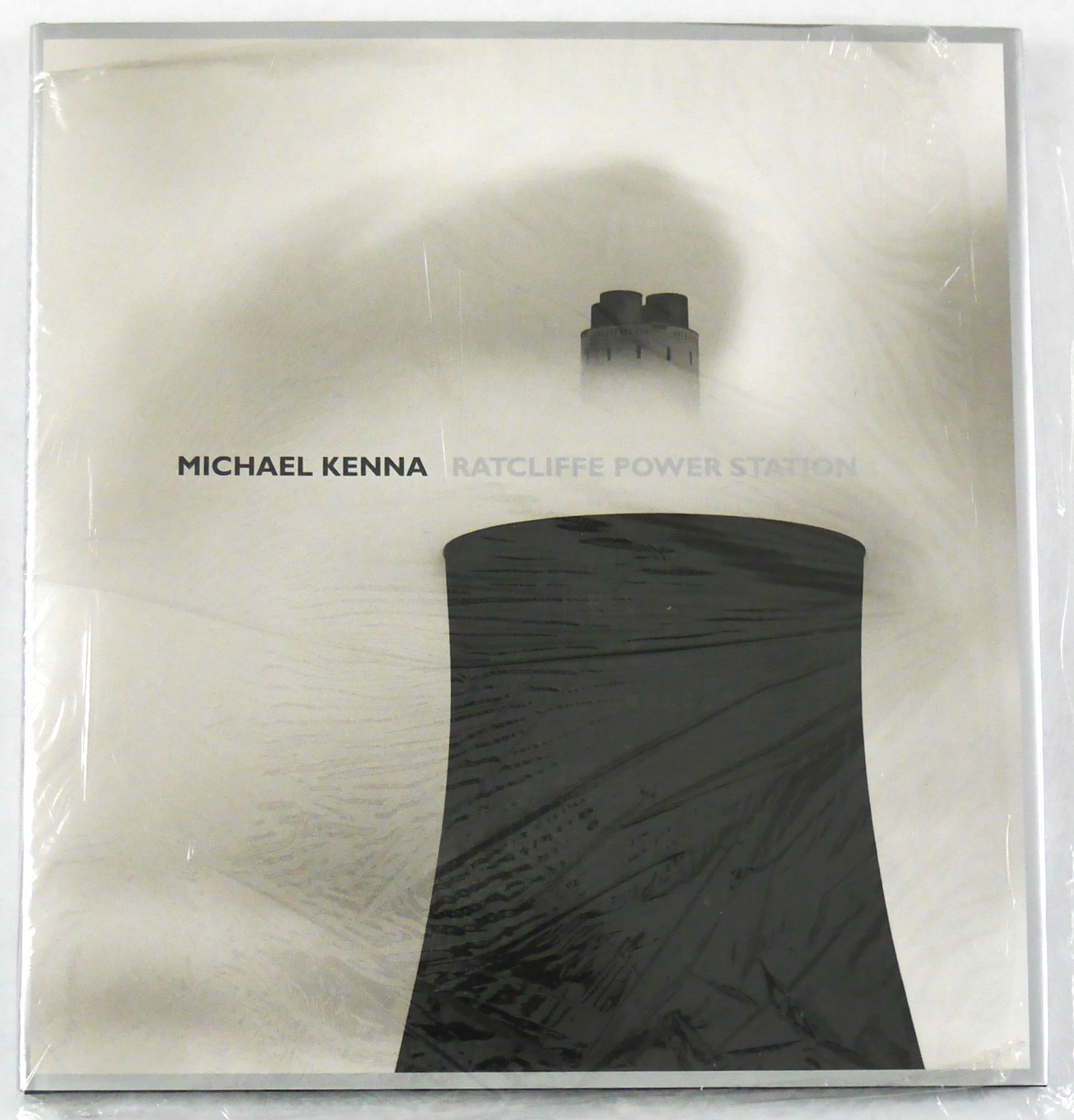 Kenna, Michael; Ratcliffe Power Station [SIGNED 1ST EDITION 1ST PRINTING - FINE]: Nazraeli Press, 2004. Book. Illus. by Michael Kenna. New. Hardcover. Signed by Author(s). 1st Edition. 4to - over 9? - 12" tall. 1st. edition, 1st. Printing 2004, Black cloth hardcover with the dust j