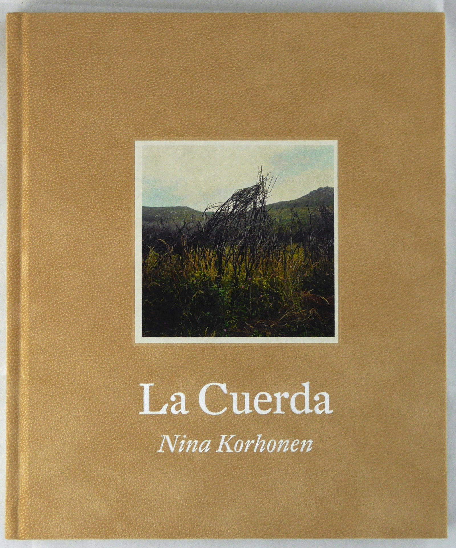 Korhonen, Nina; La Cuerda [SIGNED]: SIGNED COPY Self Published, 2013. Hardcover in faux suede boards with a hand-tipped photo on the cover. Limited edition of only 550 signed and numbered copies. 80 pages with 48 photographic images thr